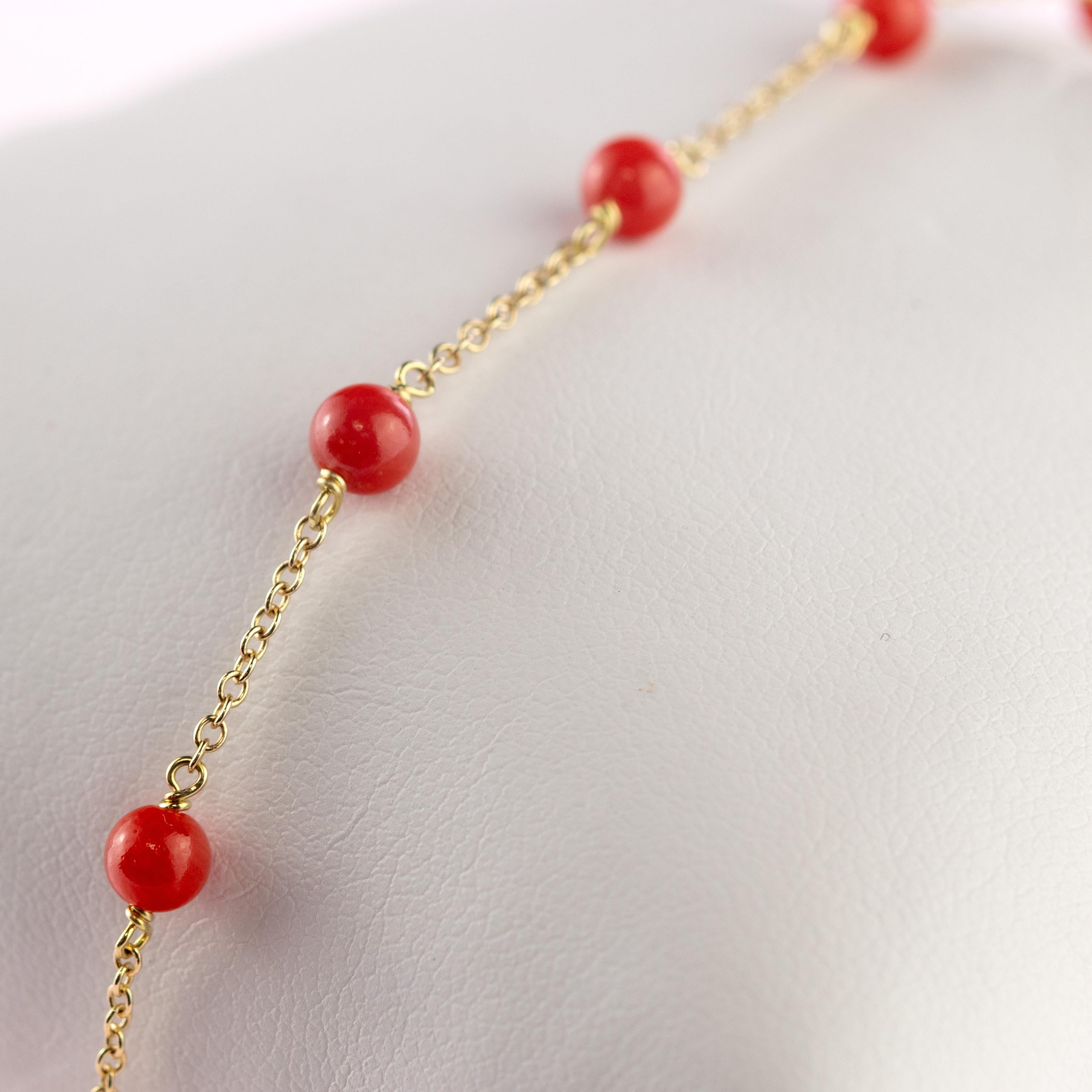 Marvellous bracelet starring pure red natural mediterranean coral spheres, for a bright charm of uniqueness. Luminous jewel with natural precious jewellery on elegant 18 karat yellow gold setting. 
 
The origin of coral is explained in Greek