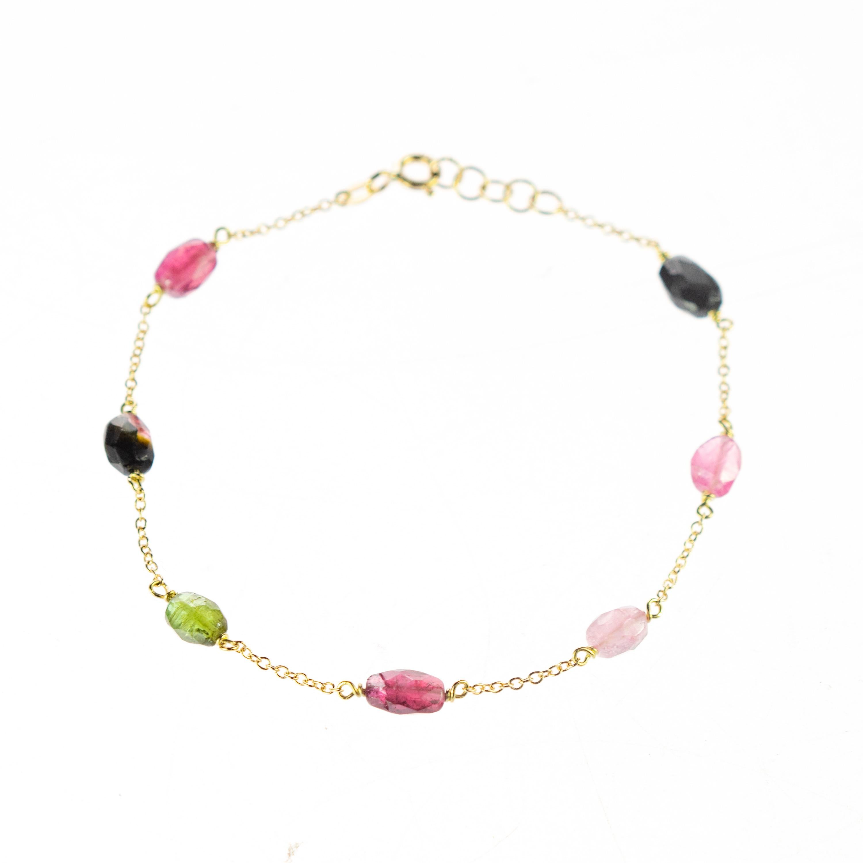 Intini Jewels signature quality on a modern and contemporary design jewel. Seven oval gems of top quality of tourmaline embellish a delicate 18 karat yellow gold chain bracelet. A jewel full of color and pasion. 

Ancient beliefs say that we should