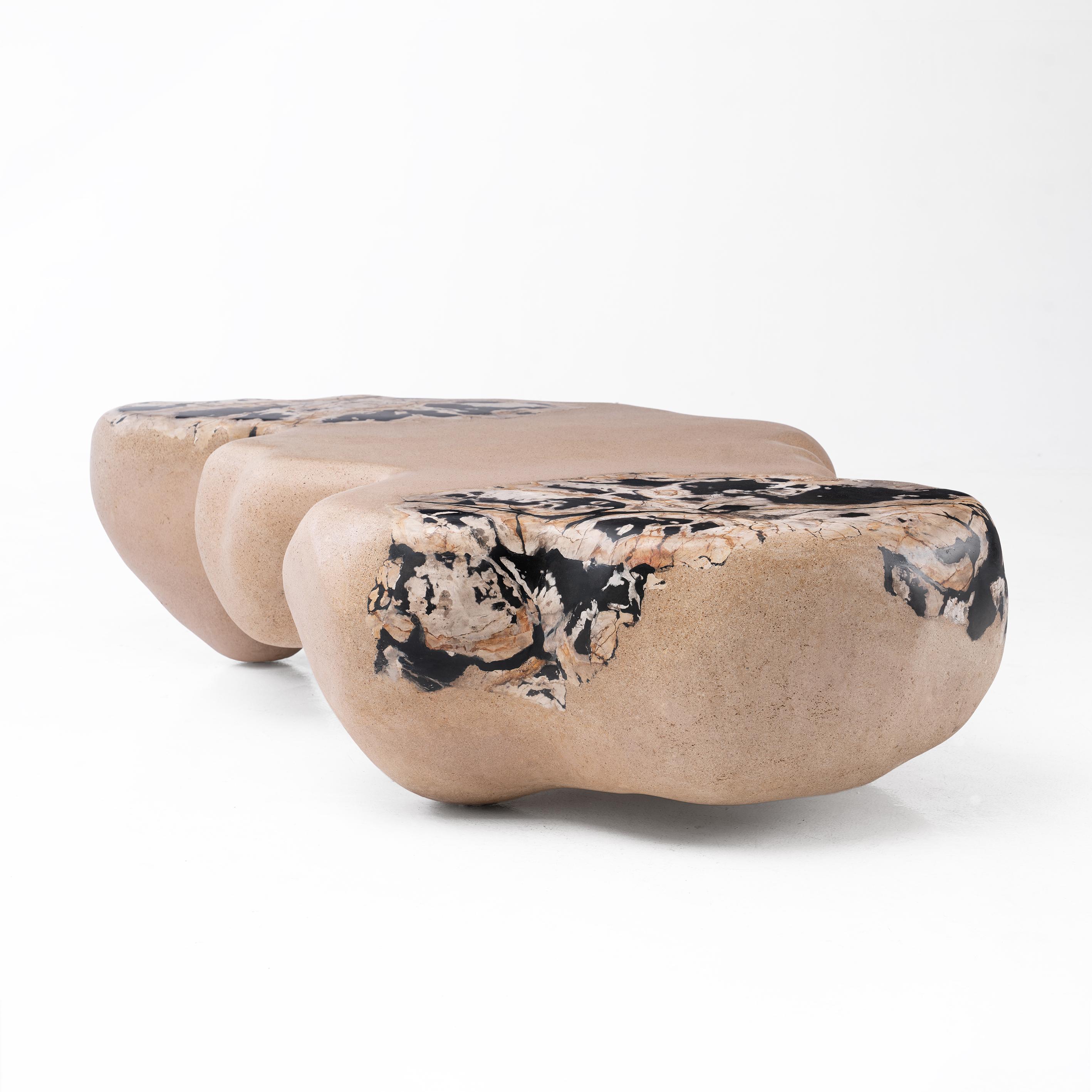 'Into The Inferno' is a sculptural coffee table, inspired by the process in which the elements and continuity of time shape our world. This piece conveys the raw beauty of geomorphic forms and the natural qualities of the materials
