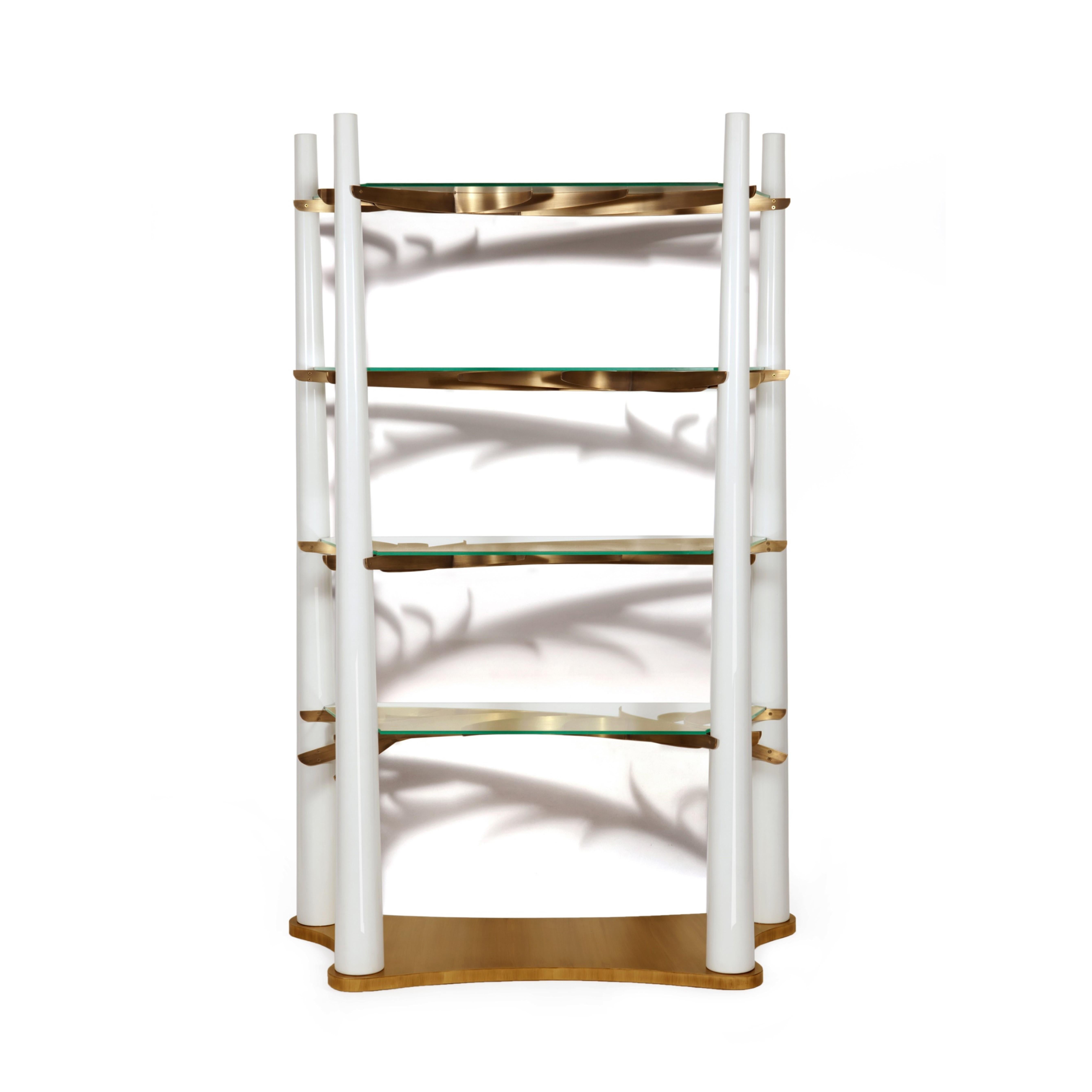 A long walk through a Swedish forest beneath intertwined branches of huge trees, was the inspiration of the dazzling Into the Woods bookcase.
The woods are captured by the elegant shape of the unique bookcase in which the vertical elements obtain a