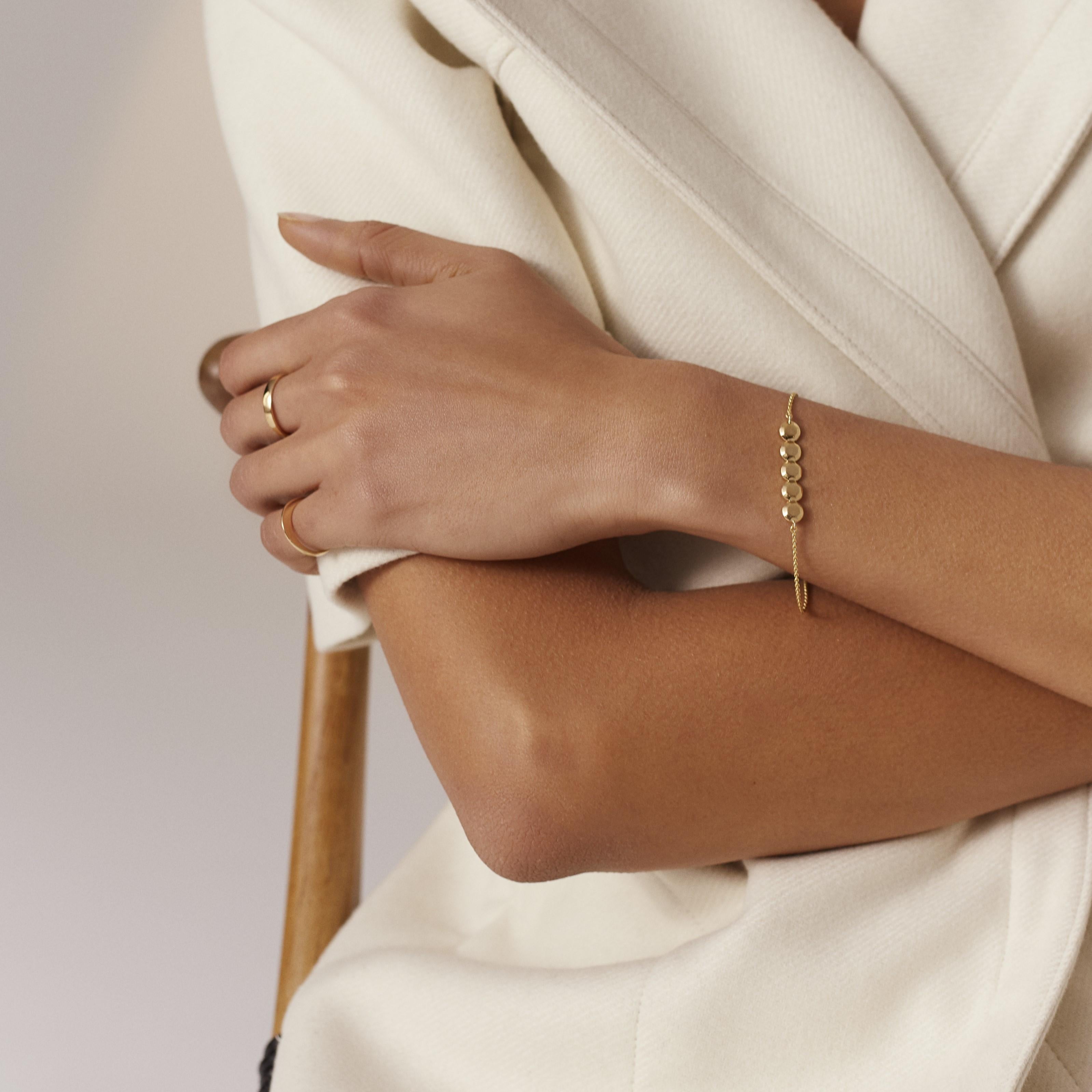 Available also in recycled sterling silver.

INTO YOU bracelet in solid, recycled 18k gold. Understated and refined, this gold bracelet with five gold ‘diamonds’ is the perfect match for a classic wardrobe designed to last. Just as all our