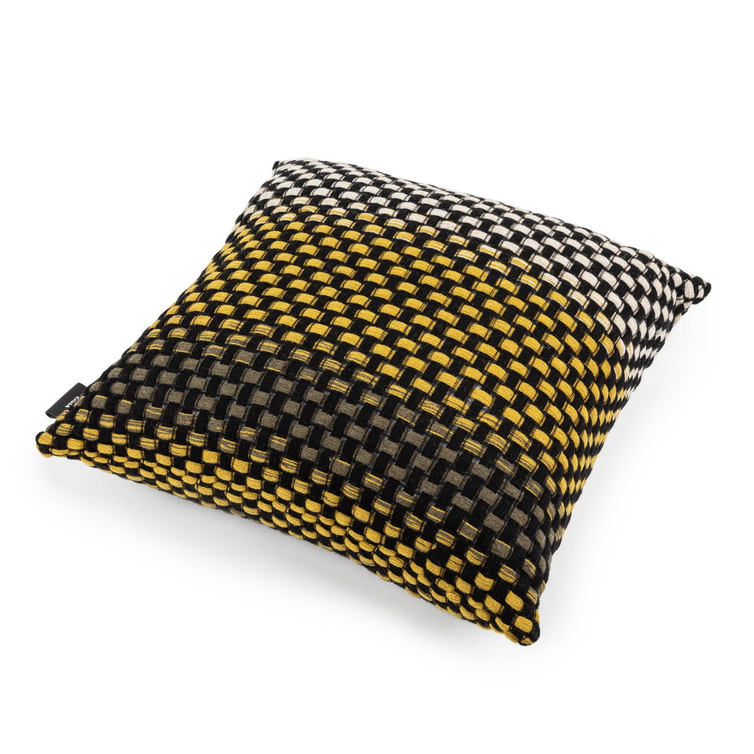 This exquisite pillow takes a twist on traditional technique: it adopts the intrecciato, or basket, weave, typically used with leather to create an intricate weave in wool. The craftsmanship here is nothing short of masterful, from the controlled