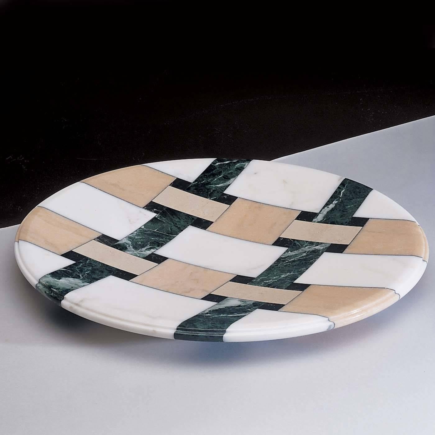 This stunning marble round centerpiece designed by Adolfo Natalini for UpGroup, will add a touch of luxury to your home. Made of white Carrara marble, it features an elegant pattern of intersecting stripes in green and pink marble of striking visual