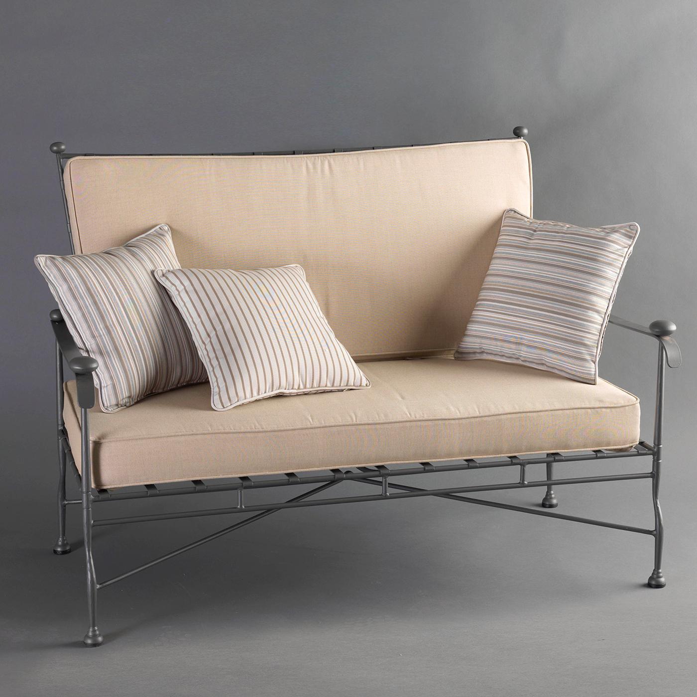 A superb addition to a patio, pool area, or terrace, this two-seat sofa is the result of masterful metalworking skills. Entirely made of stainless steel, this lovely piece evokes the relaxing charm and timeless elegance of the Tuscan countryside.