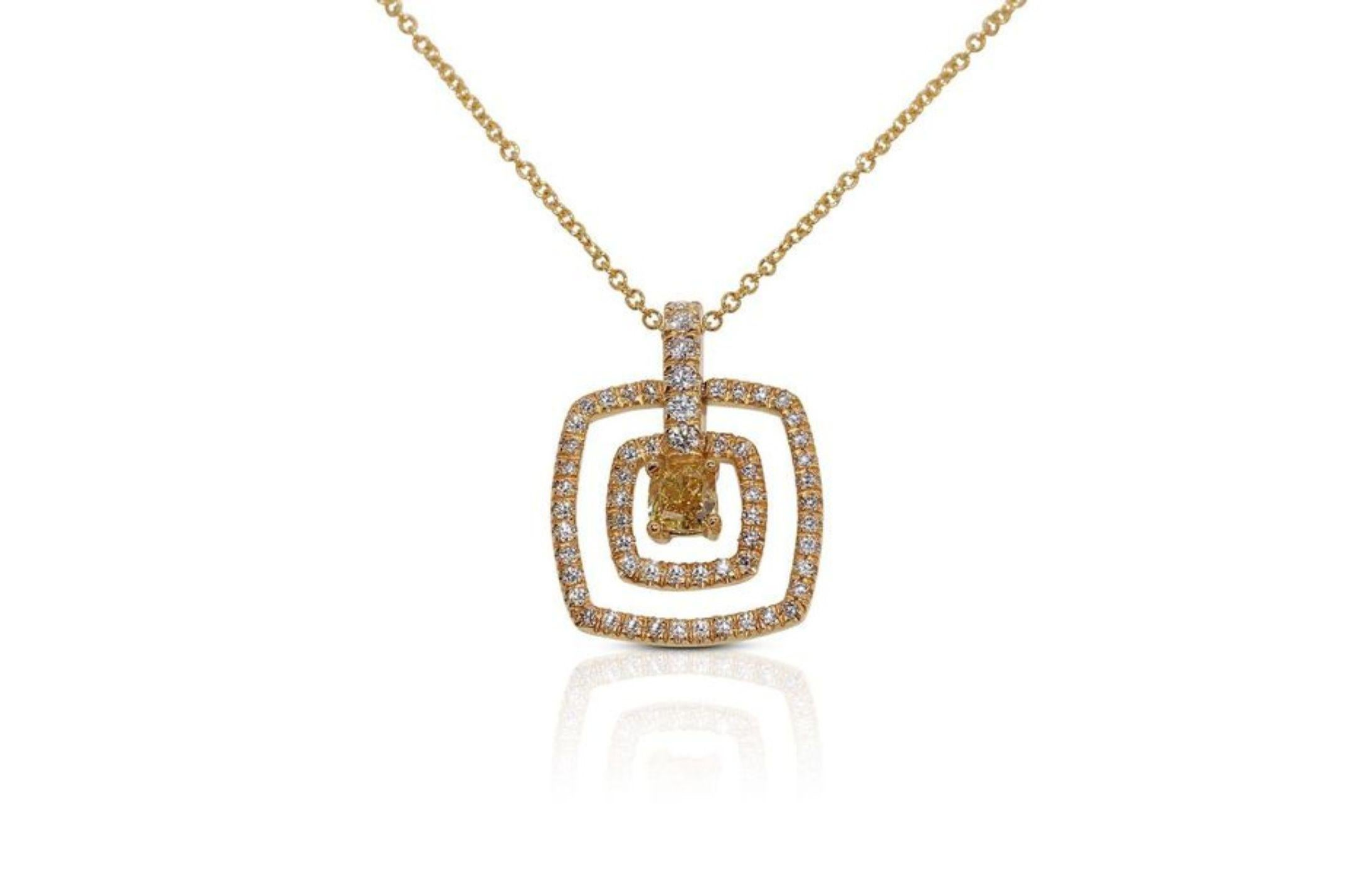 The necklace chain, crafted from radiant 18K yellow gold, adds a warm and luxurious touch to the piece. The intricate detailing of the goldwork enhances the overall design, creating a seamless and delicate flow that complements the brilliance of the