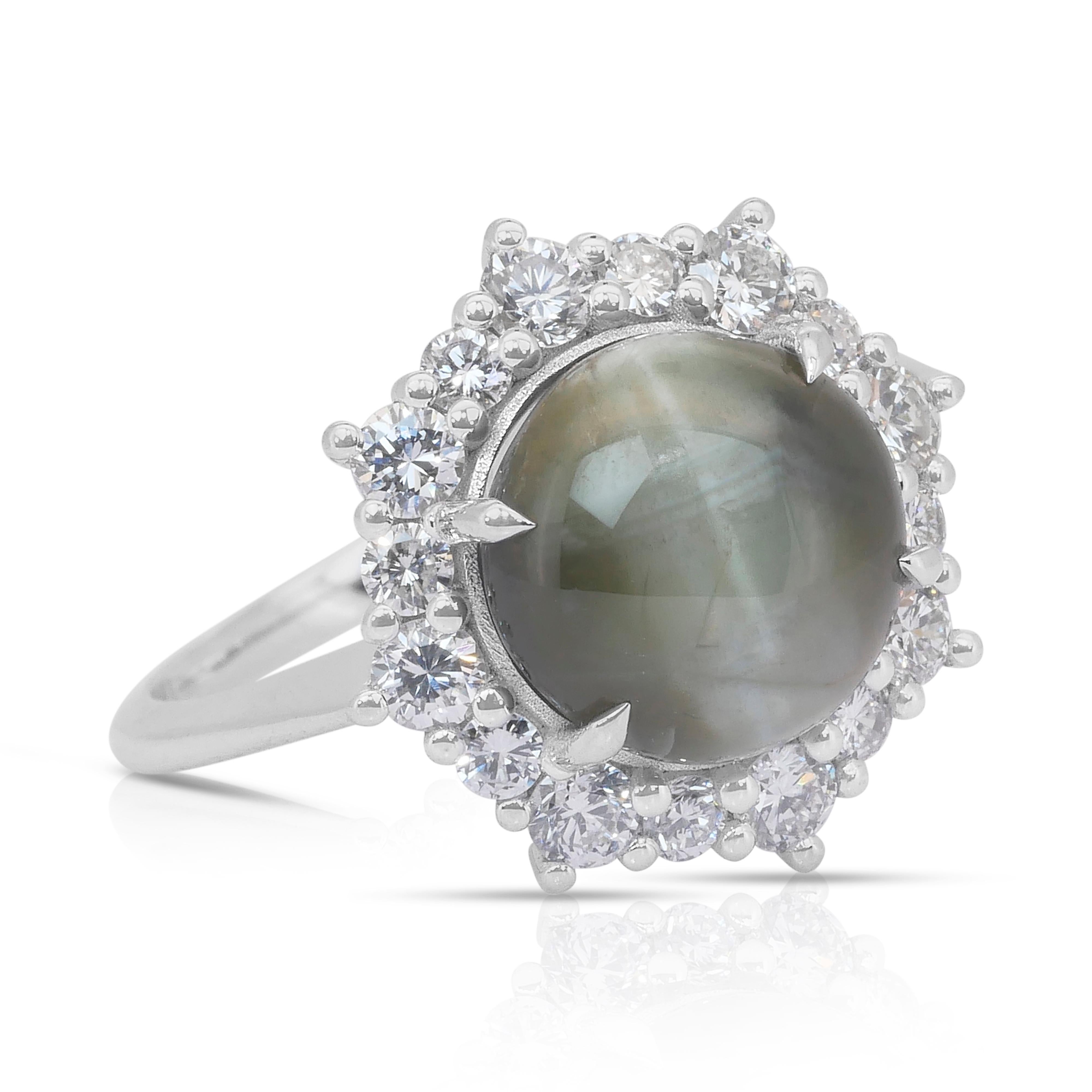 Intricate 6.71ct Cat's Eye Chrysoberyl and Diamonds Cocktail Ring in 18k White Gold - GIA Certified

Showcasing a captivating 5.76-carat near-round cat’s eye chrysoberyl in a striking yellowish-green hue, this 18k white gold cocktail ring is a true
