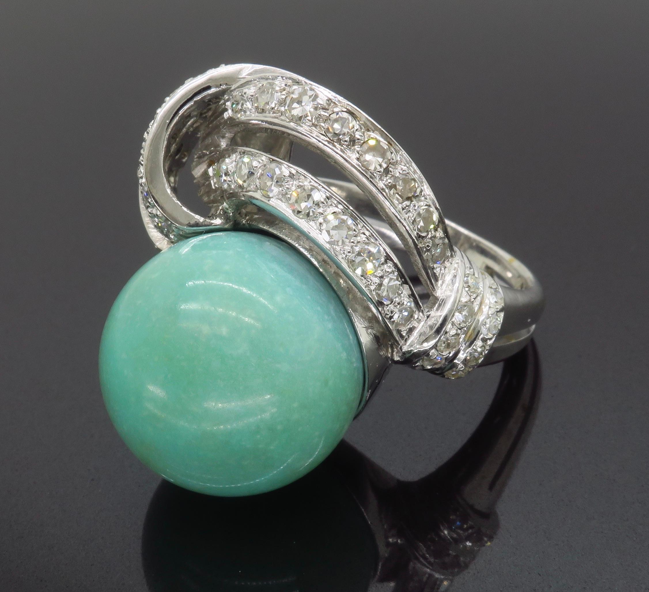 Incredible opaque Chalcedony ring surrounded by diamonds set in 14k white gold. 

Gemstone: Chalcedony 
Gemstone Measurements: 16-24mm circular 
Diamond Carat Weight: 1.50CTW
Average Color: F-G
Average Clarity: VS-SI
Metal: 14k White Gold