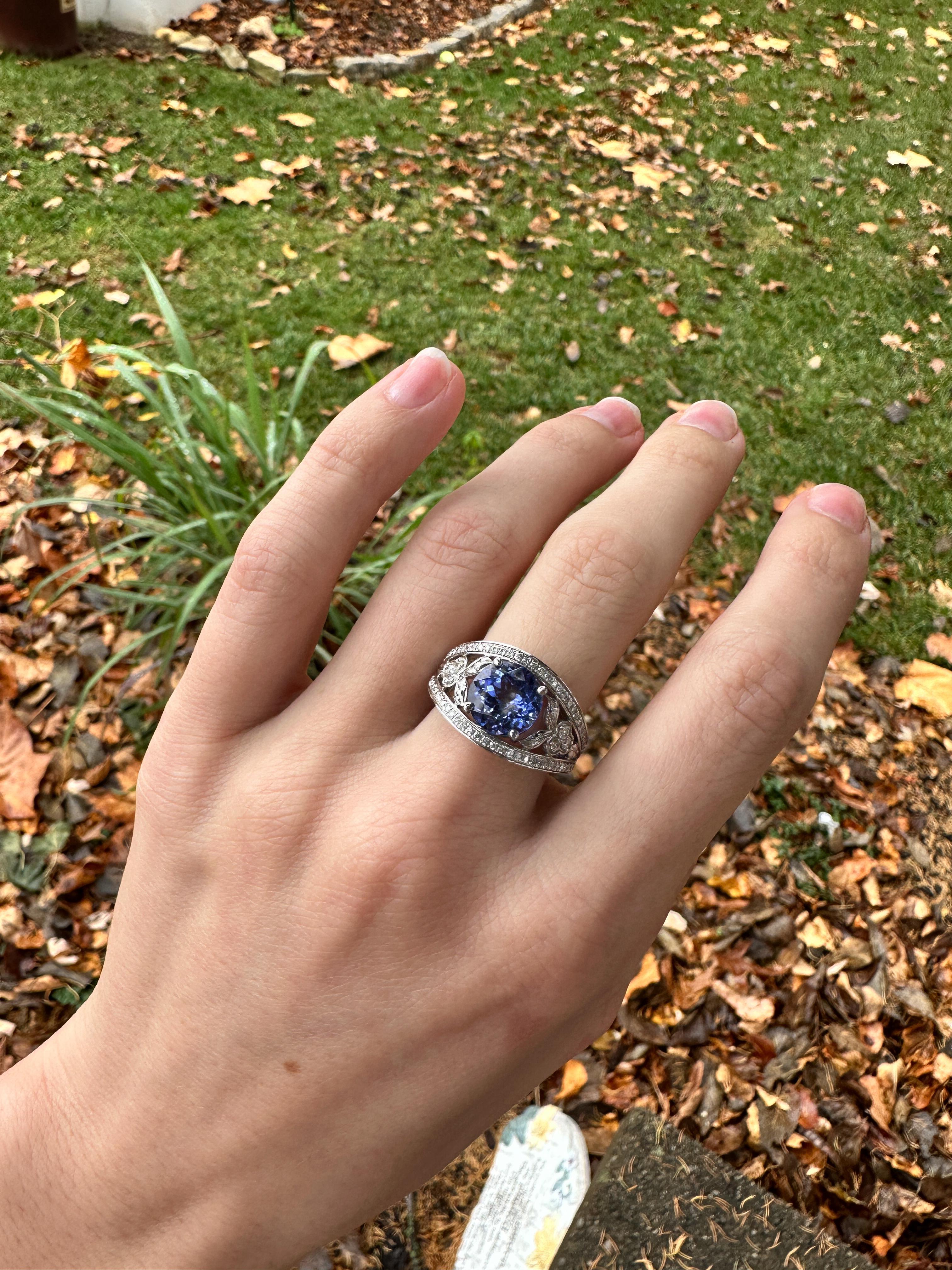 Elegant 3.19ct Tanzanite Ring in solid 14k White Gold with earth mined Diamond Accents. Featuring an intricate design and a sparkling 9mm Round Tanzanite stone, this stunning piece exudes luxury and sophistication. Perfect for adding a touch of