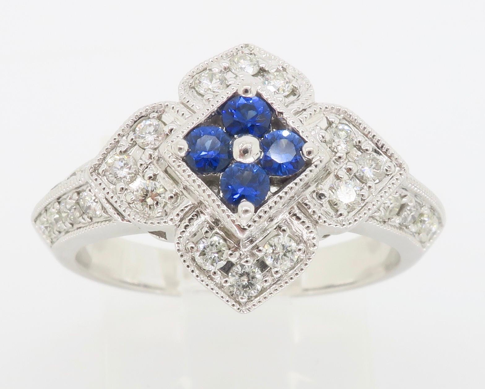 Intricate diamond & blue sapphire ring made in a stunning floral design. 

Gemstone: Sapphire & Diamonds
Gemstone Carat Weight:  Approximately .20CT Blue Sapphire
Diamond Carat Weight:  Approximately .40CTW
Diamond Cut: Round Brilliant Cut 
Color: