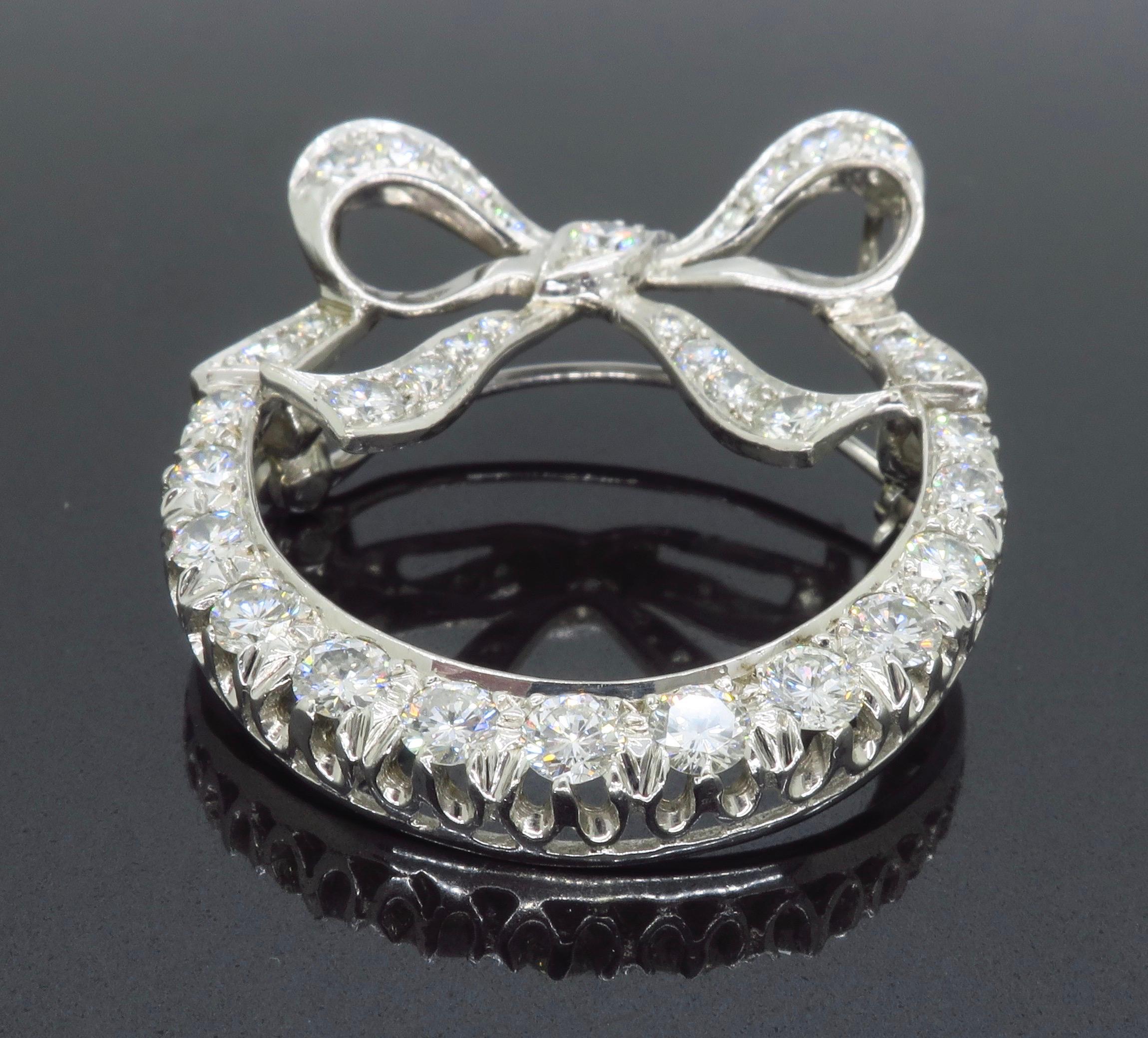 Round Cut Intricate Diamond Bow Brooch For Sale
