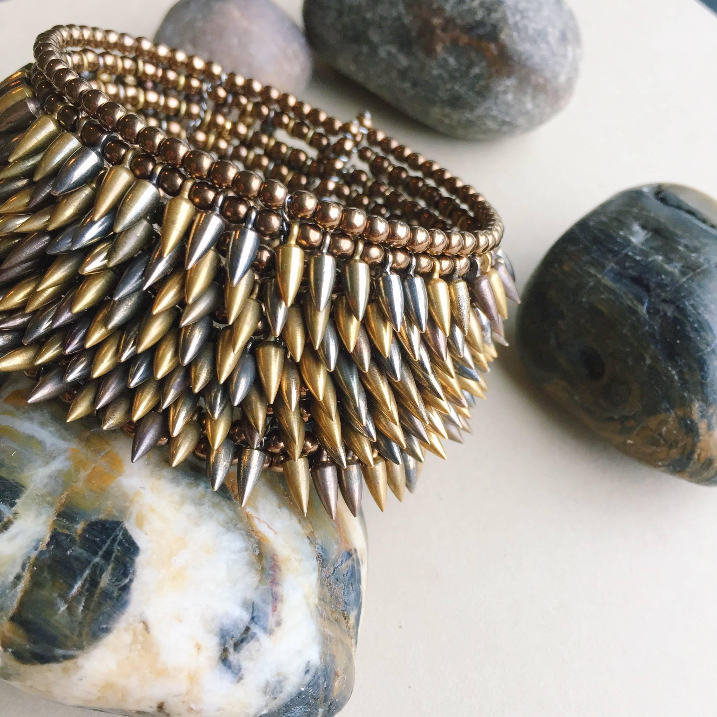 Artisan Intricate Eight Row Mixed Tone Bullet Bronze Bead Flexible Cuff