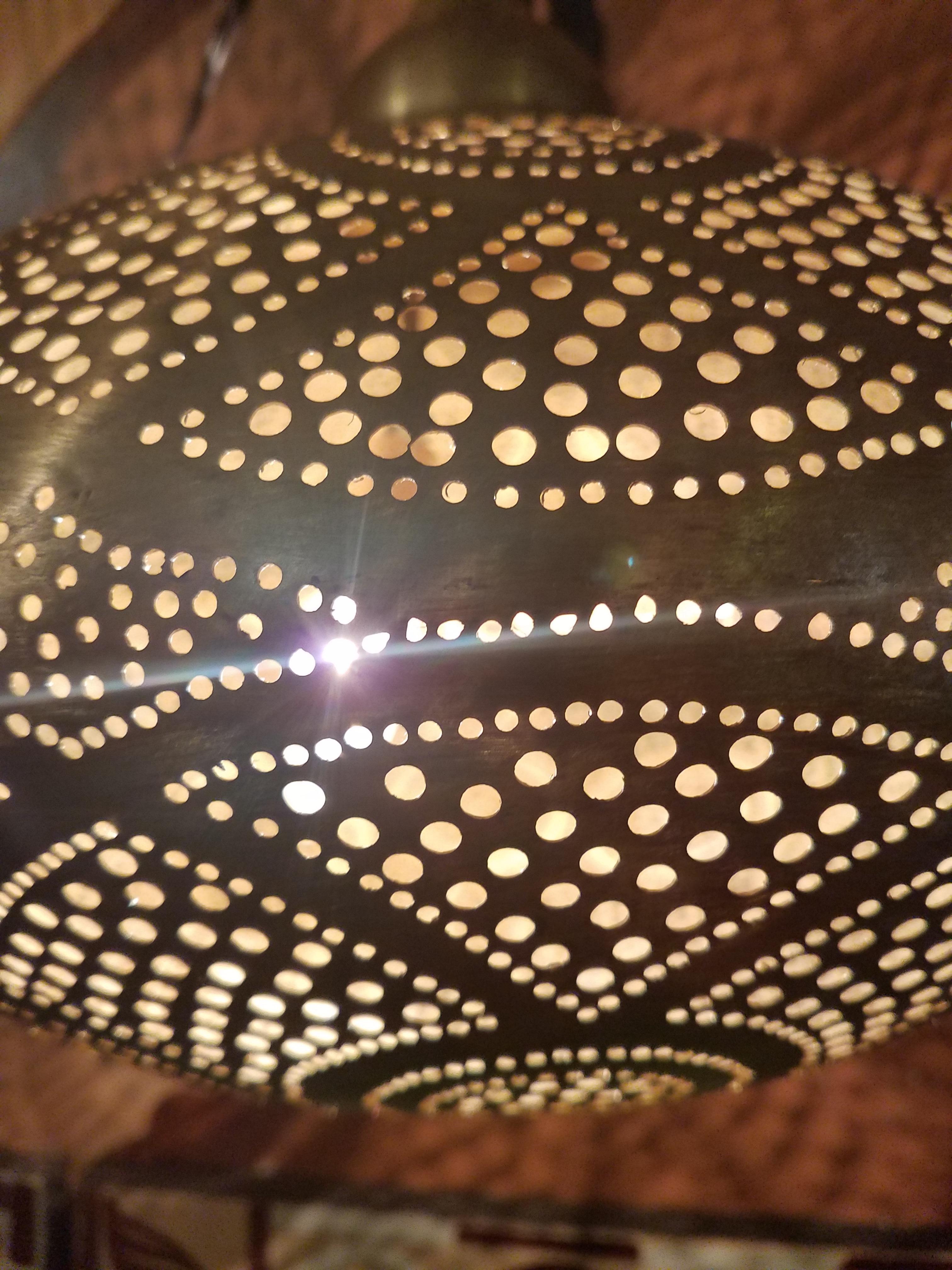 Made from pure copper, these beautiful Moroccan wall and ceiling lamps are sure to be show-stoppers anywhere in your home. Each is handmade using ancient artisan methods which consist of puncturing the surface with a unique, elaborate design, so