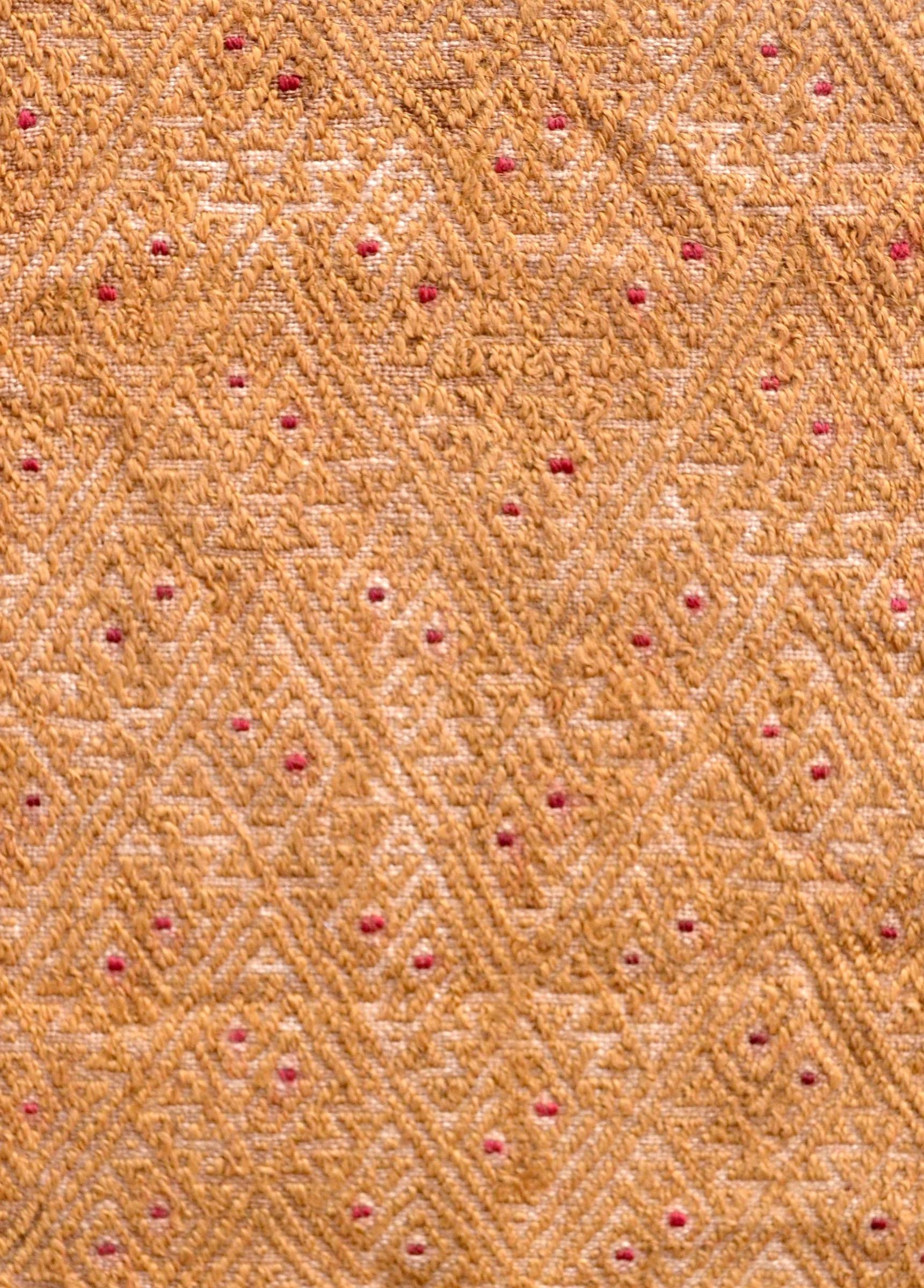 Extremely detailed yellow embroidered Pre-Columbian textile fragment with hints of red from the Chancay culture in Peru. This piece is framed in a black shadowbox.

It is a wonder to behold antiquities such as a Pre-Columbian textiles, an