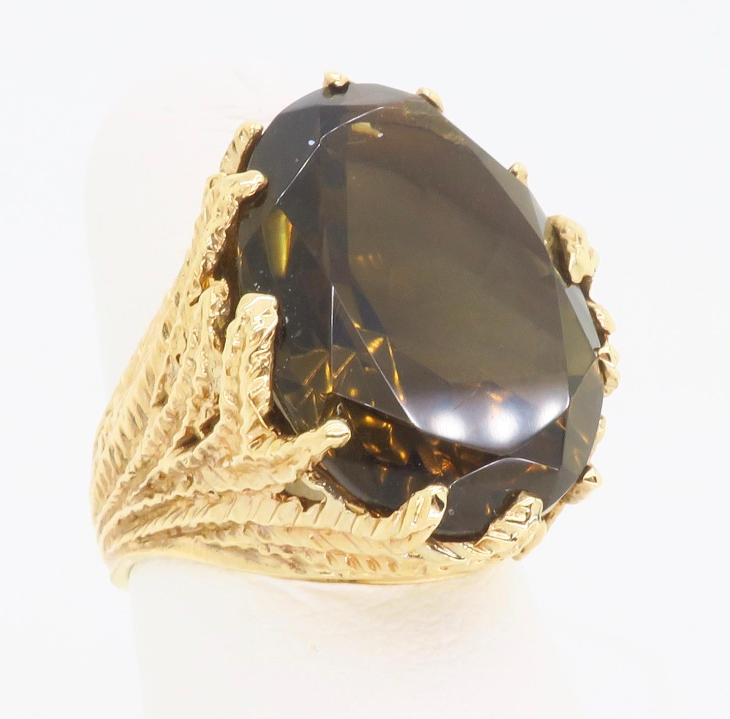 Large Smokey Quartz set into an intricate 14k yellow gold setting. 

Gemstone: Smokey Quartz
Gemstone Size: 19.8 x 15mm
Metal: Yellow Gold
Marked/Tested: 