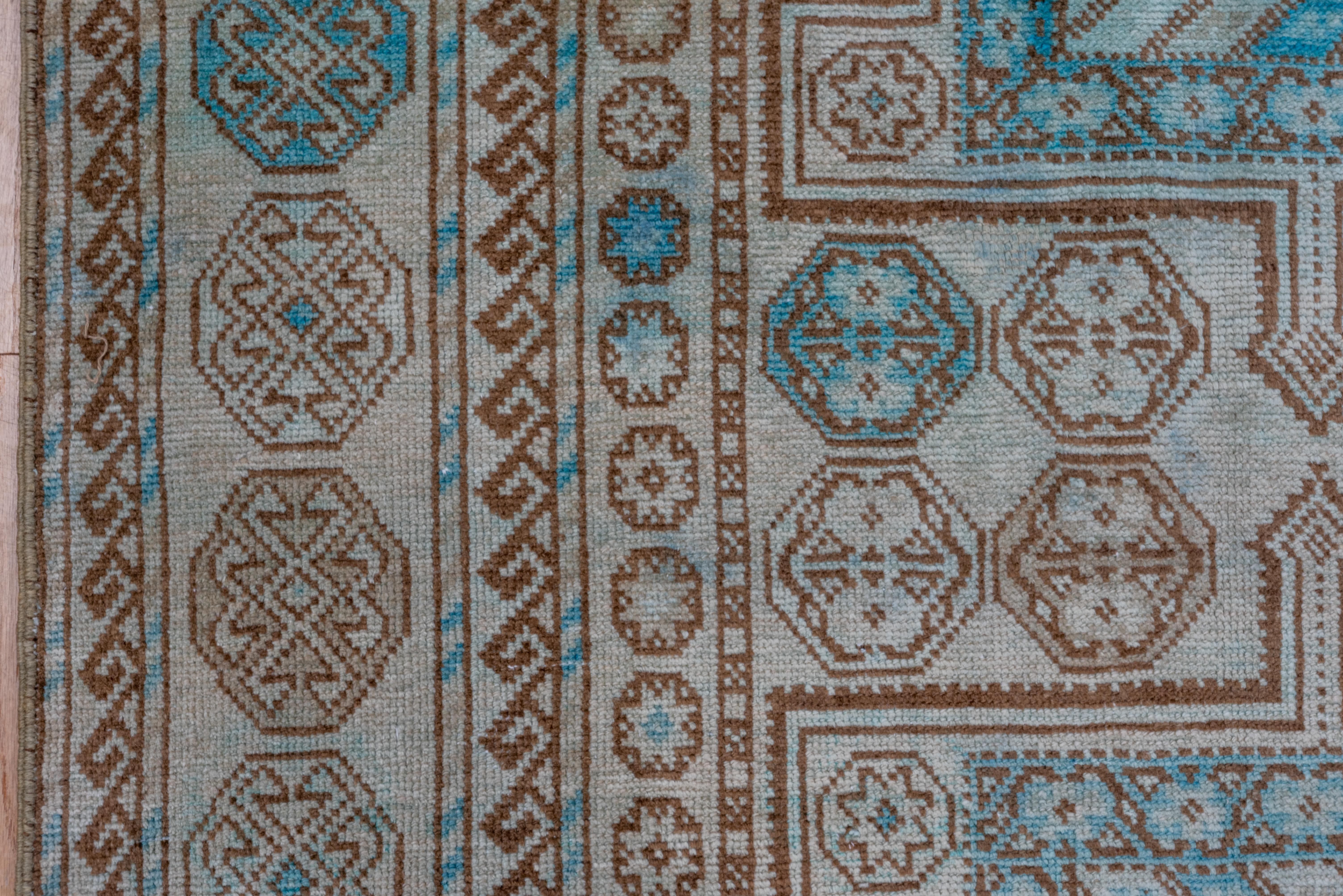 Intricate Symmetry: A Turkish Rug's Dance of Teal and Taupe in Geometric Splendo In Good Condition For Sale In New York, NY