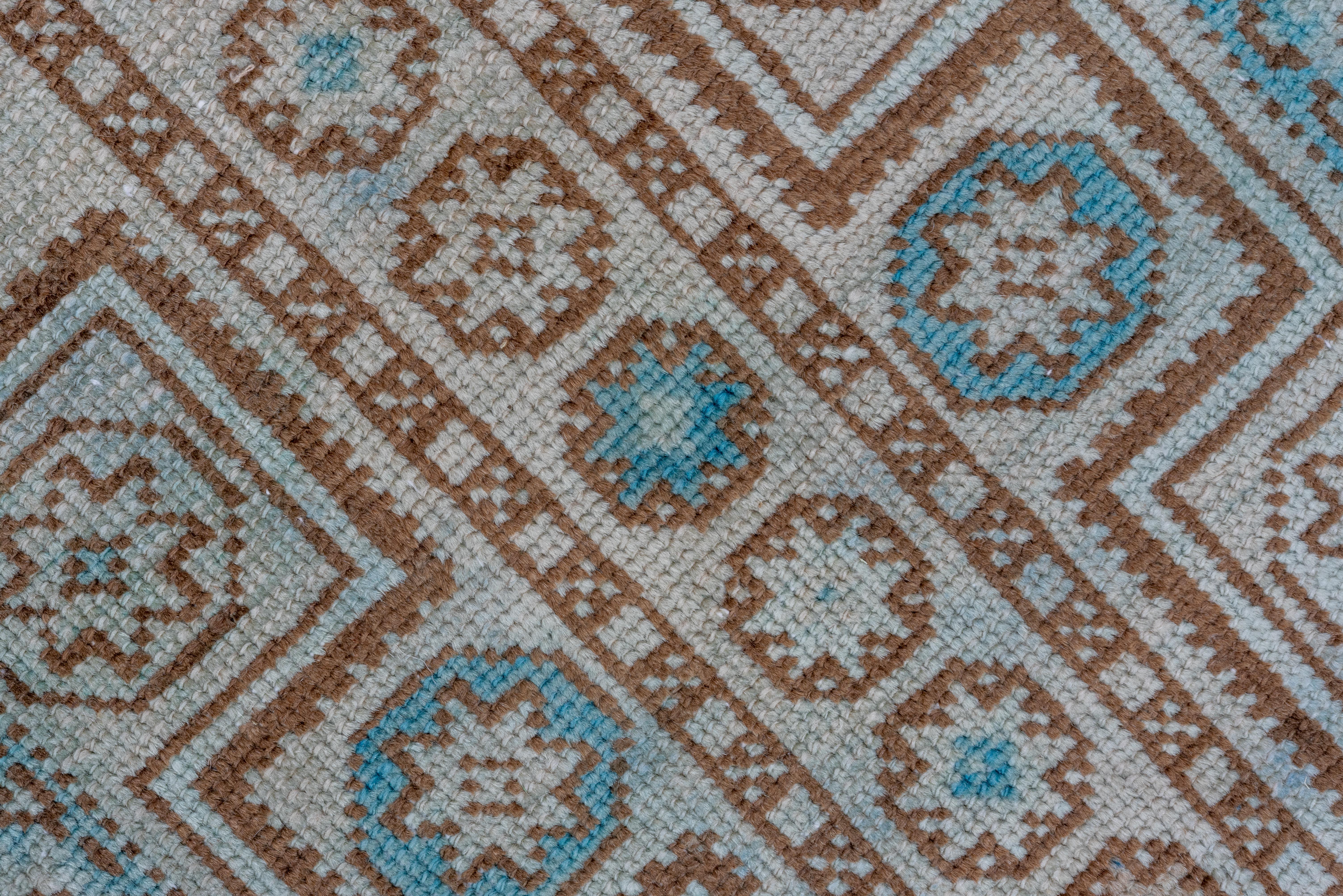 Mid-20th Century Intricate Symmetry: A Turkish Rug's Dance of Teal and Taupe in Geometric Splendo For Sale