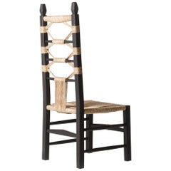 Intricately Carved and Hand Woven Fireside "Nannai Chair" by Chiara Andreatti
