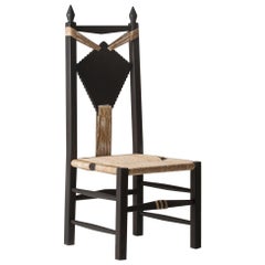 Intricately Carved and Handwoven Fireside "Ines Chair" by Chiara Andreatti