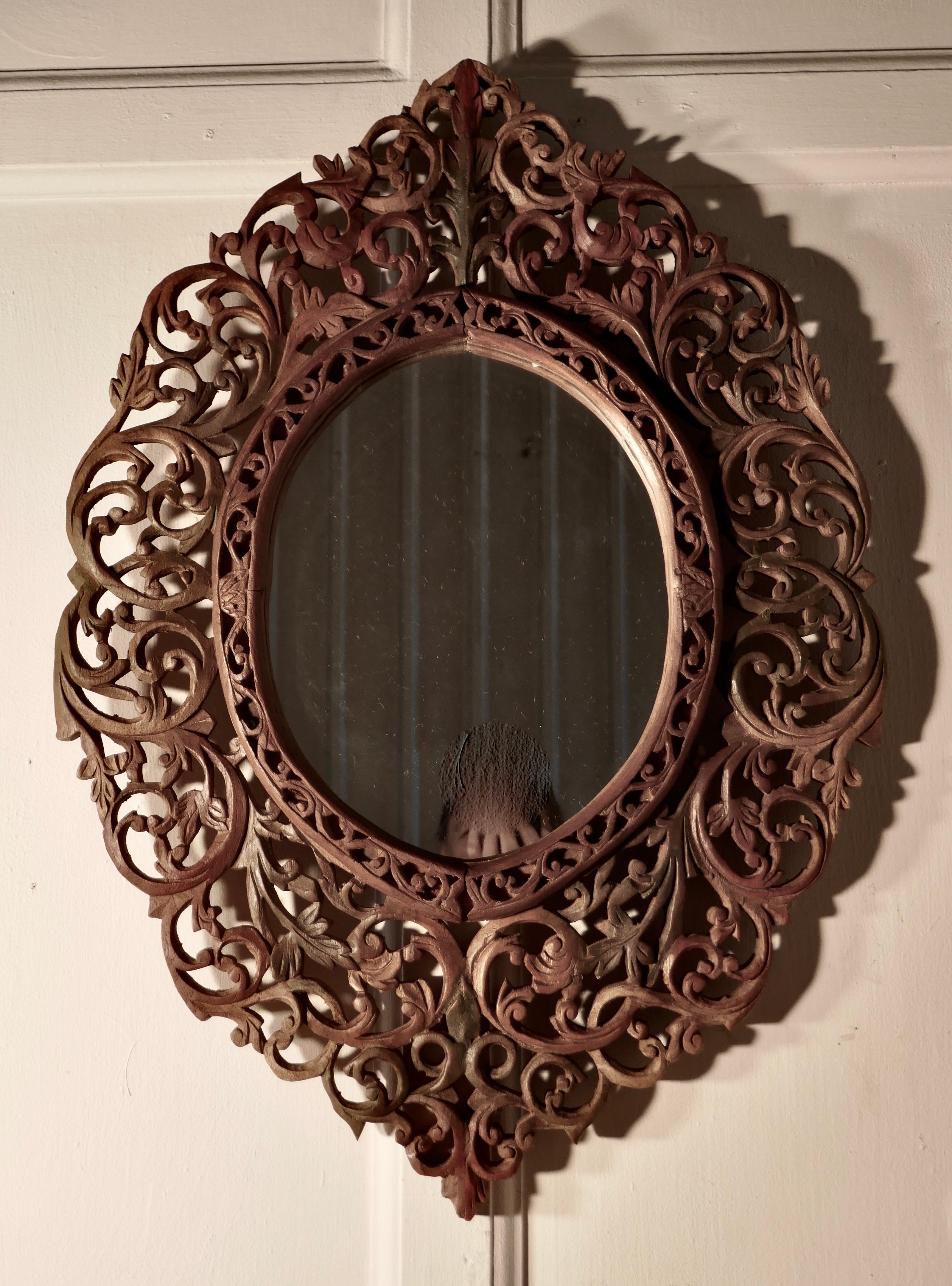 Intricately carved Islamic oval mirror

A lovely piece from the east intricately carved in Islamic style, the otherwise bare wood is delicately tinted in muted colors
The Mirror is 26” high and 18” wide
TPG35.
         
