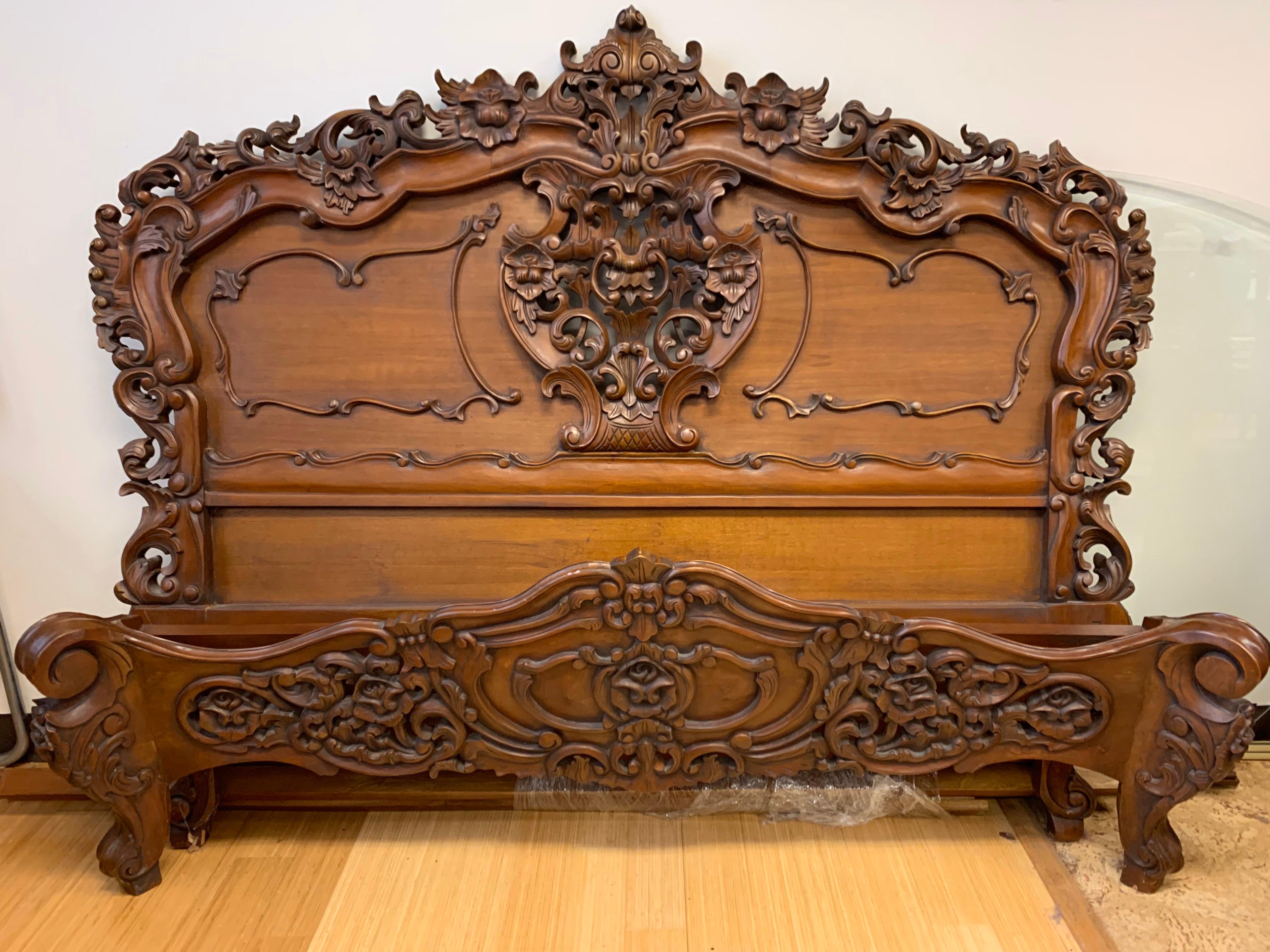 Intricately carved mahogany bed which will fit all queen size mattresses. Comes with headboard, footboard and rails. The carved workmanship on the wood is extraordinary. Set up is a breeze with slotted design.