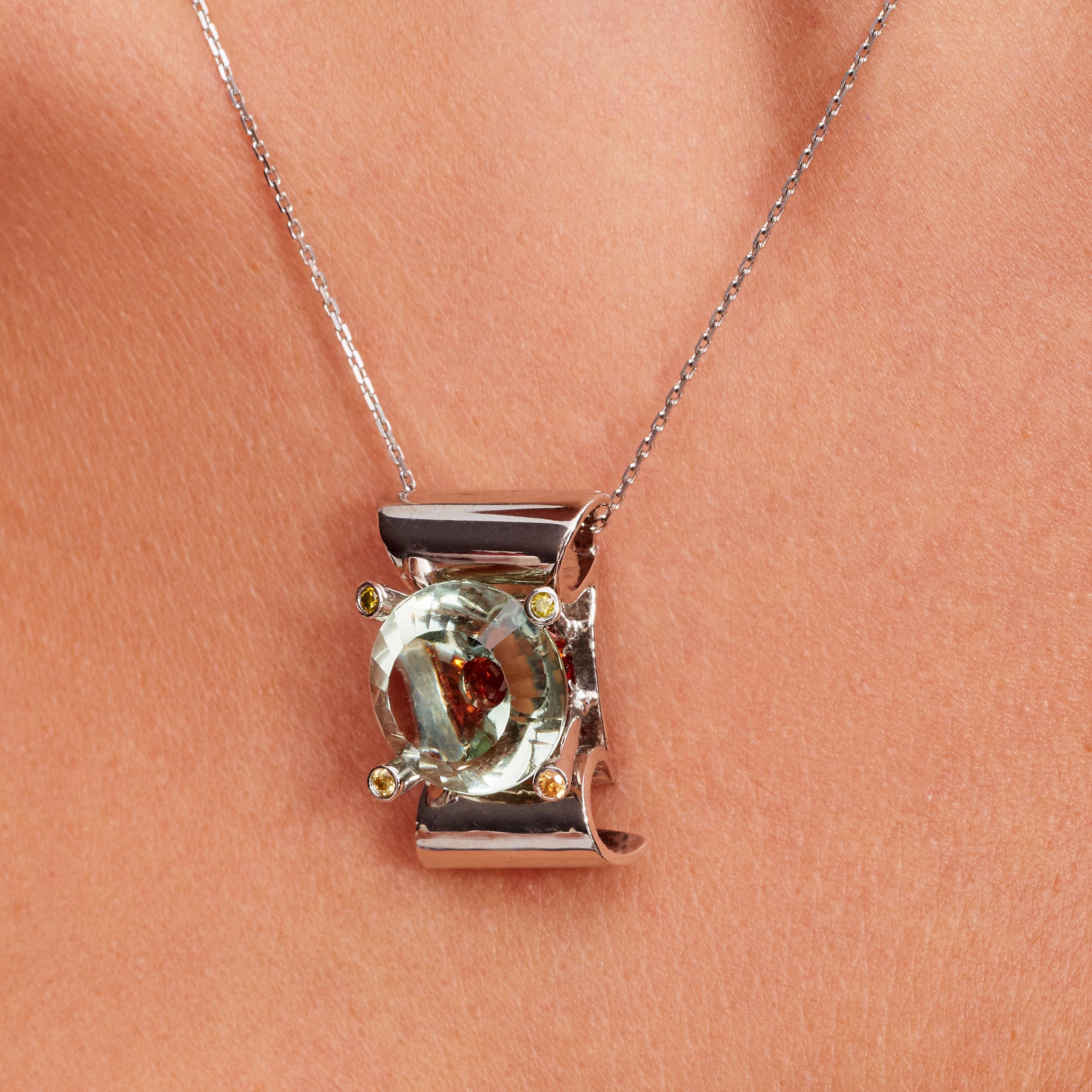 9 Carat Prasiolite, Spessartite, Diamond, White Gold Pendant Necklace, In Stock. This pendant necklace is made out of 18-karat white gold and comes with the 18-karat white gold chain it’s shown on. The center stone in the necklace is a nine carat