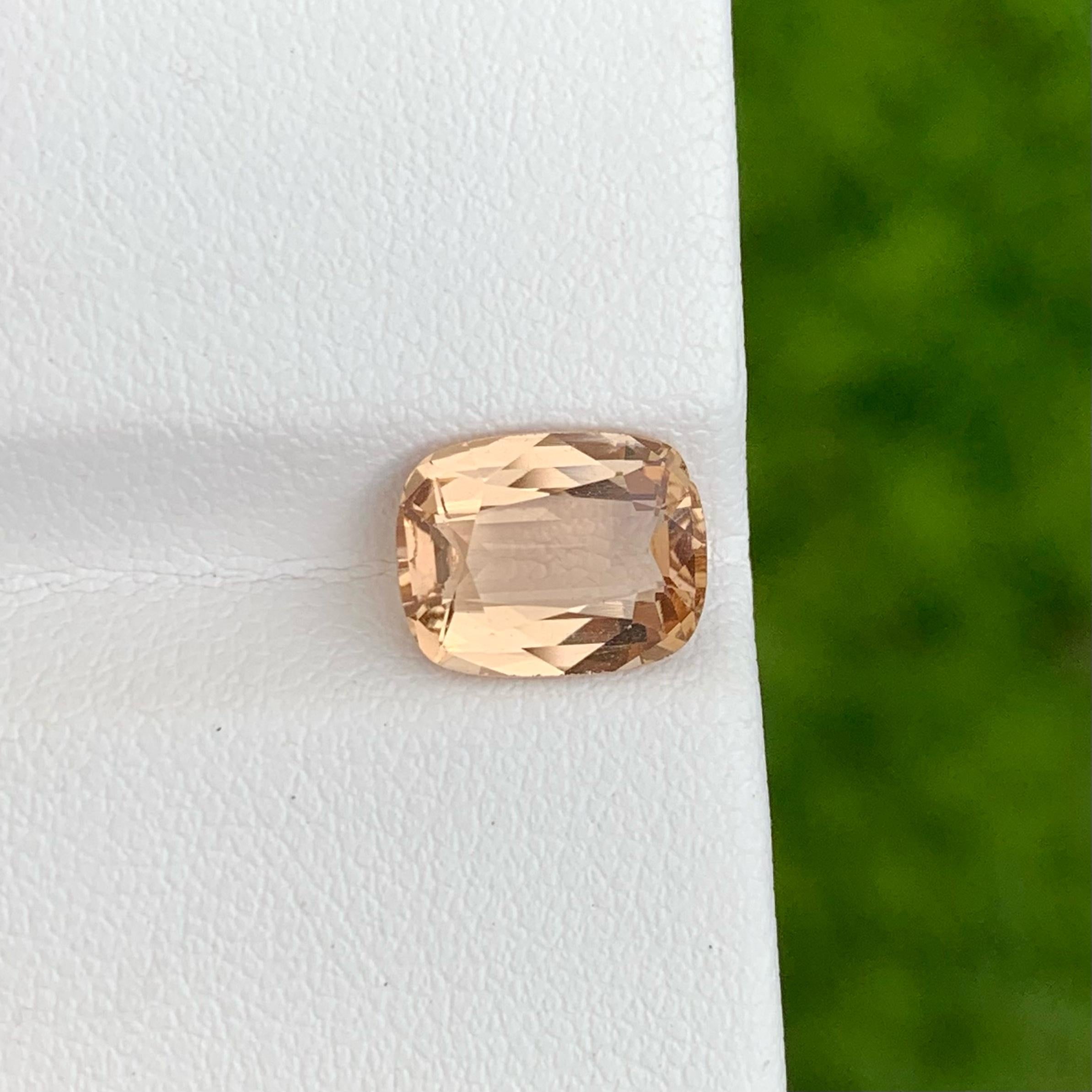 Weight 3.10 carats 
Dimensions 9.9x7.8x4.5 mm 
Treatment none 
Origin Pakistan 
Clarity Eye Clean 
Shape cushion
Cut fancy Cushion 

Imperial Natural Topaz gemstone exudes a captivating palette of deep golden tones, reminiscent of a radiant sunset
