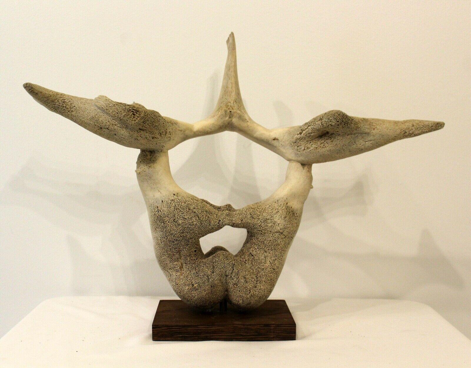 Antique Inuit Whale bone Sculpture. Very Unique Inuit unsigned sculpture. The artist utilized the unique shape of the bone to showcase 
the two mirrored polar bears balancing the two seals in a very simple stylized manner. 

Dimensions: 25.5w x