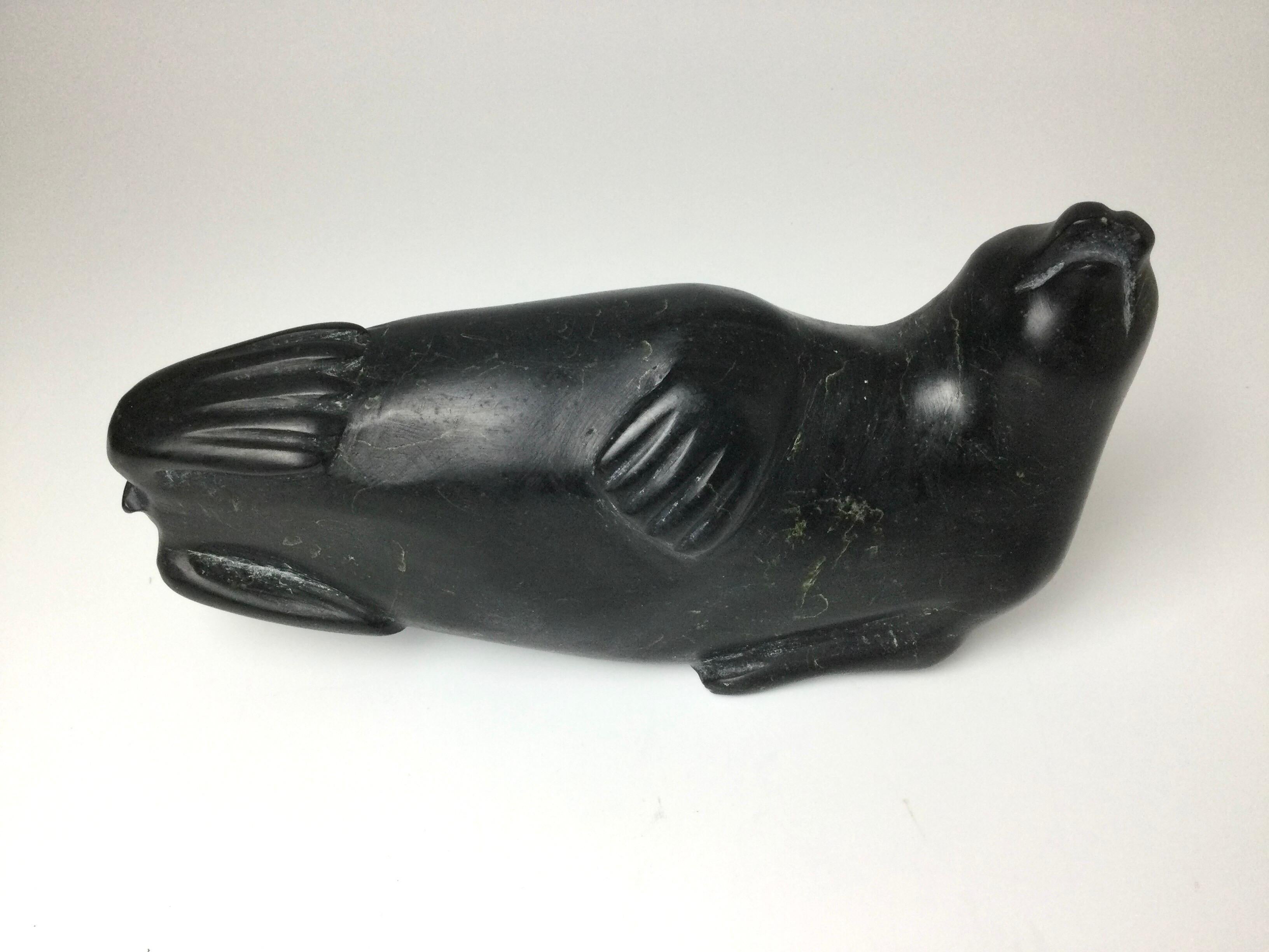 Inuit Eskimo stone carving of seal with original tag. I believe the carver to be C. D. Teen. I purchased out of a home 20 years and was told at that time it had been on the shelf for as long as the family could remember. I feel it is from the