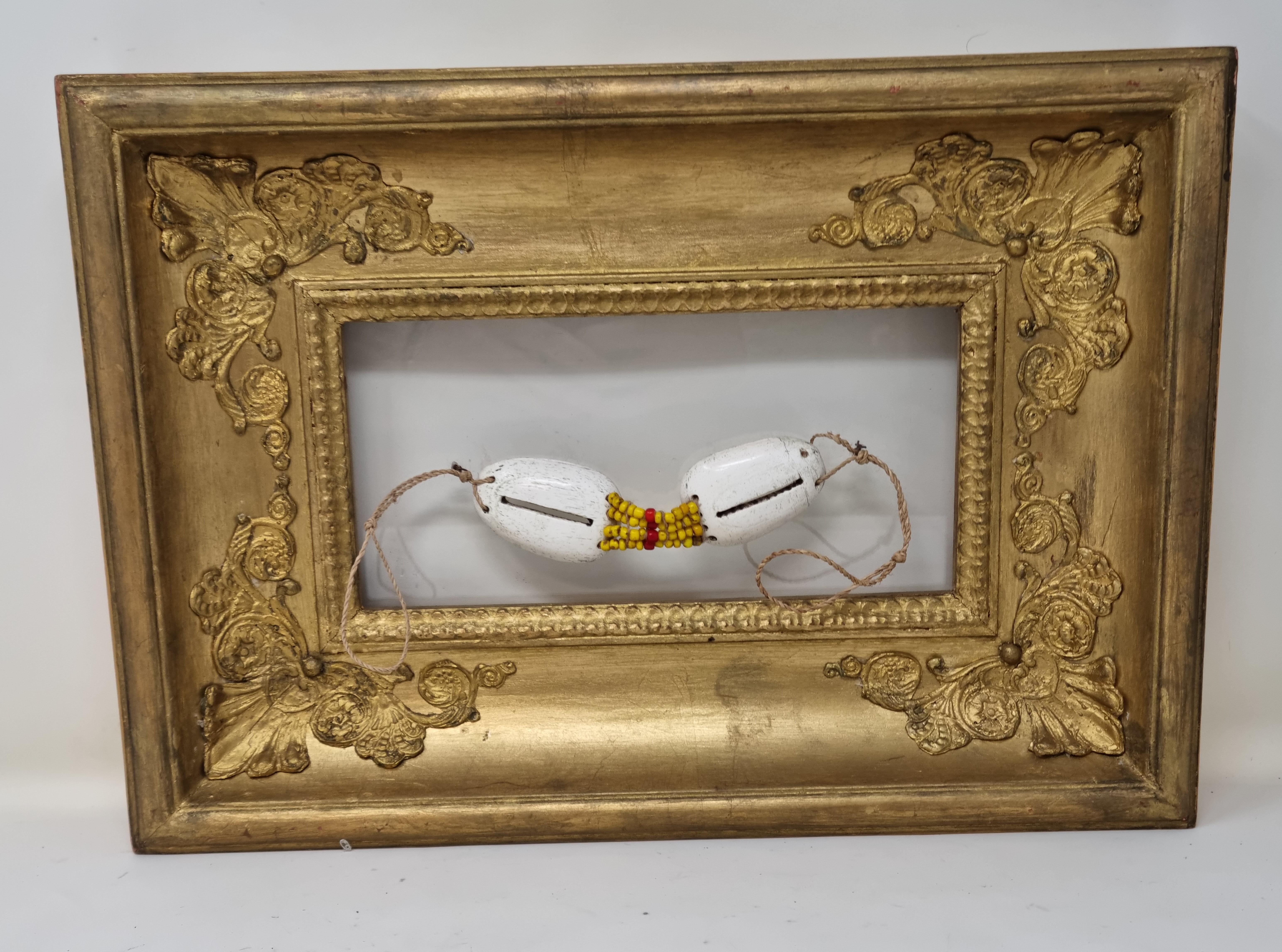 Inuit glasees in golden frame.