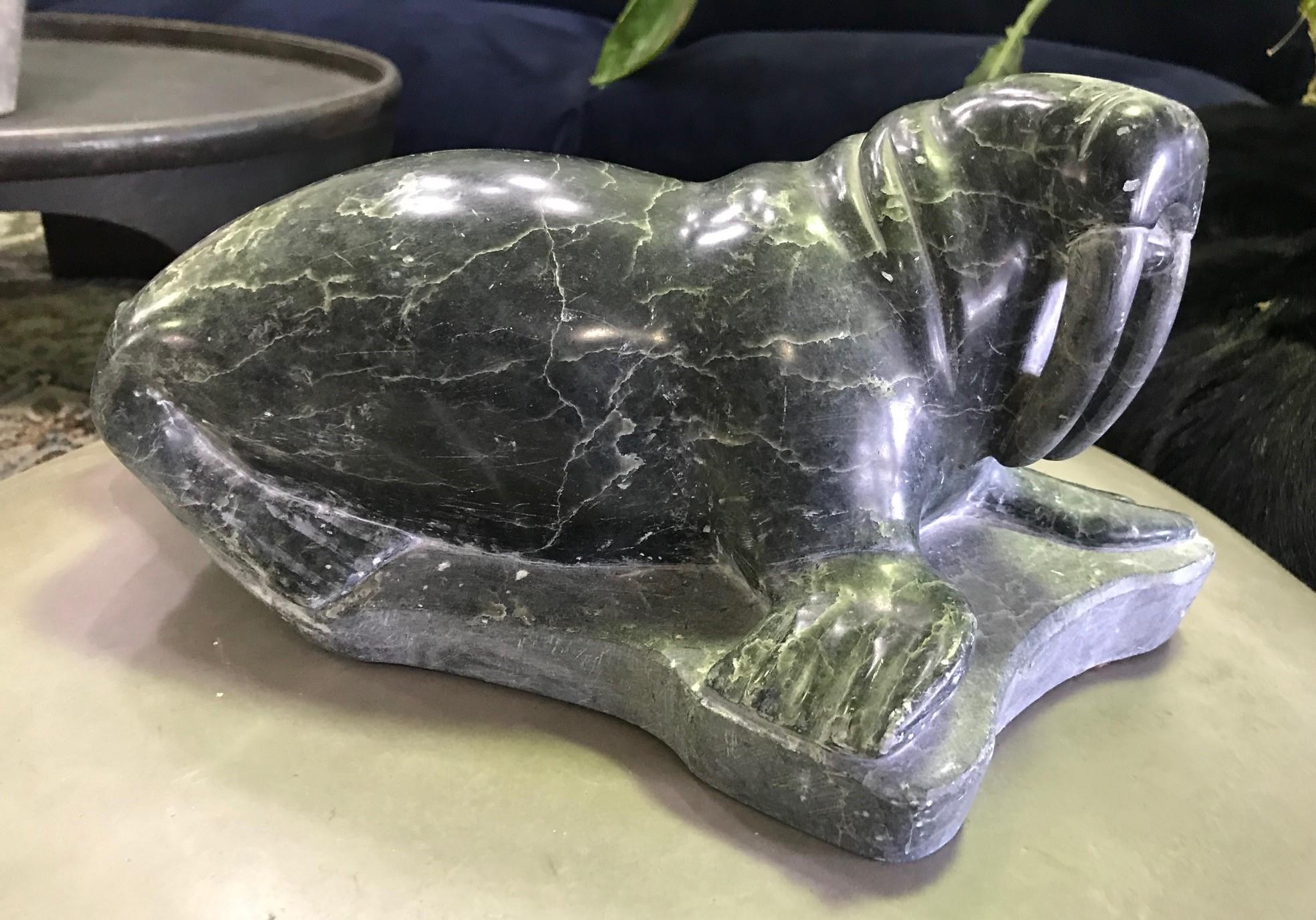 A wonderful soapstone large, heavy carving of a tusked walrus by the indigenous inuit people who inhabit parts of the Arctic regions of Greenland, Canada, and Alaska.

Signed on the underside.

From a collection of Native and North American