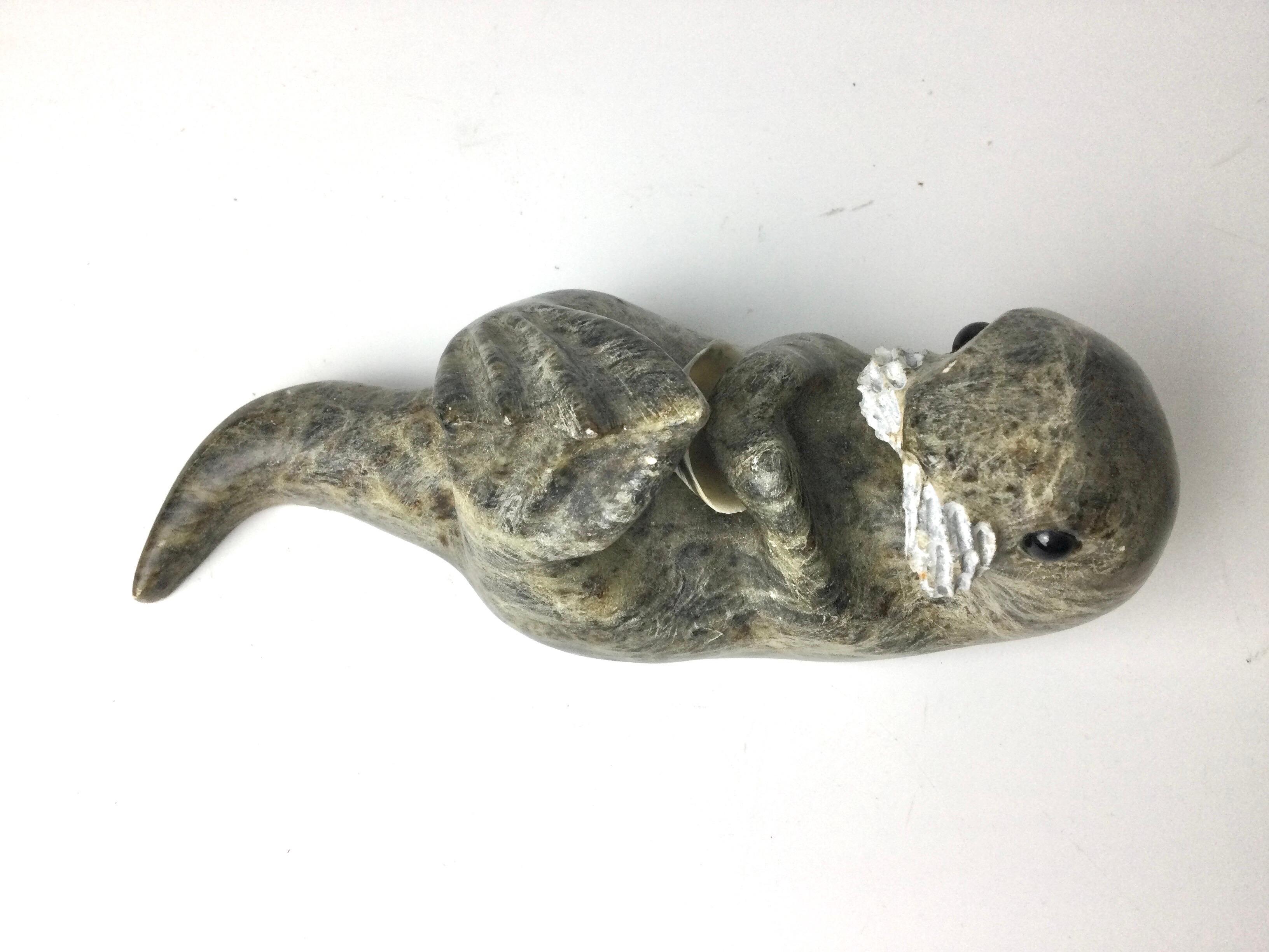 North American Inuit Stone Carving of a Otter with Shell Signed Drake For Sale