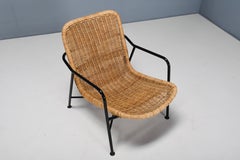 Inventive adjustable rattan armchair #514 by Dirk van Sliedregt, 1952.