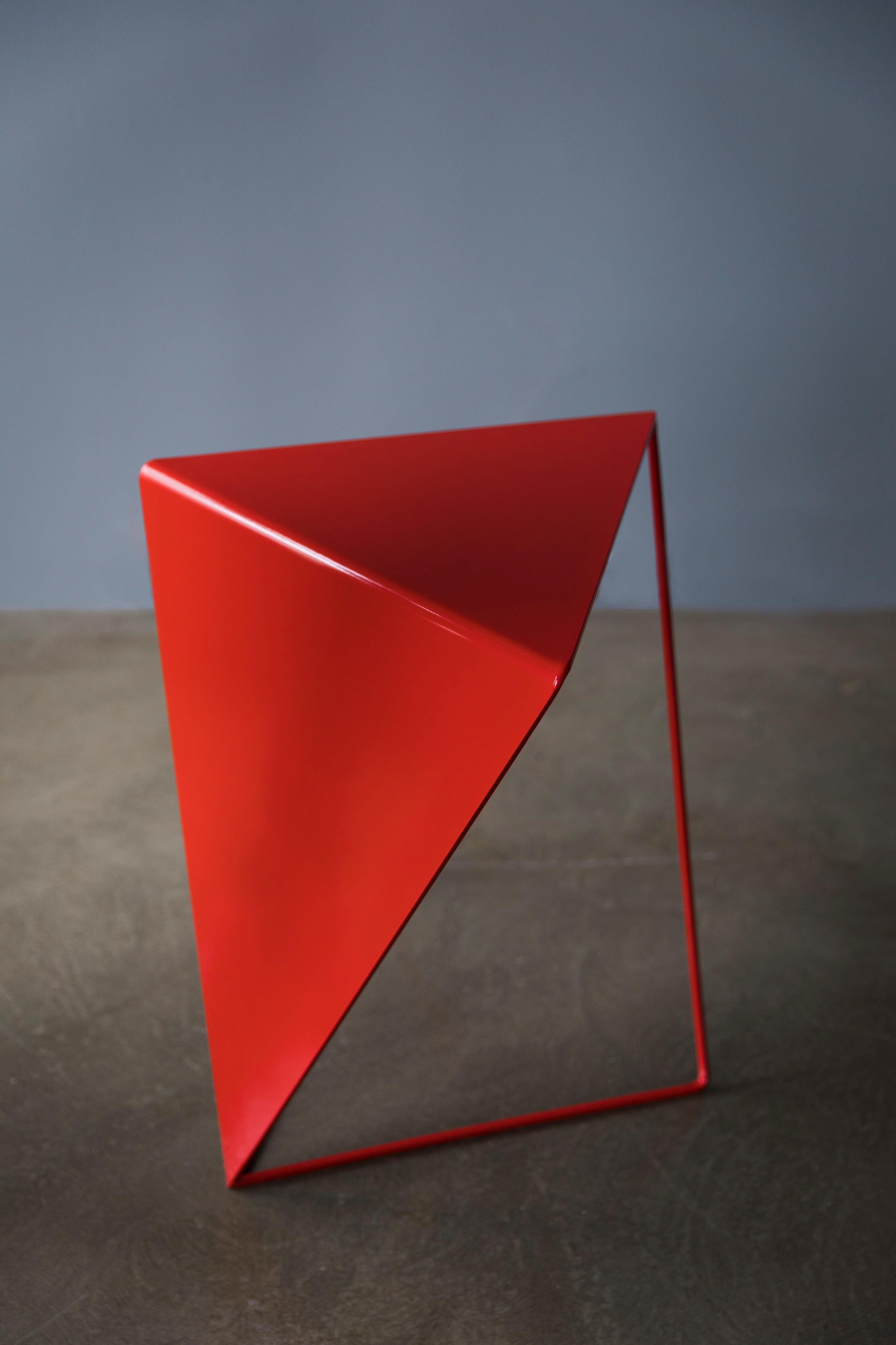 Characterised by pure geometric shape INVERSE table is about playing with spatial qualities involving the interactions of lines void and volume. It consists of a triangular tabletop and the corresponding frame providing two standing positions within