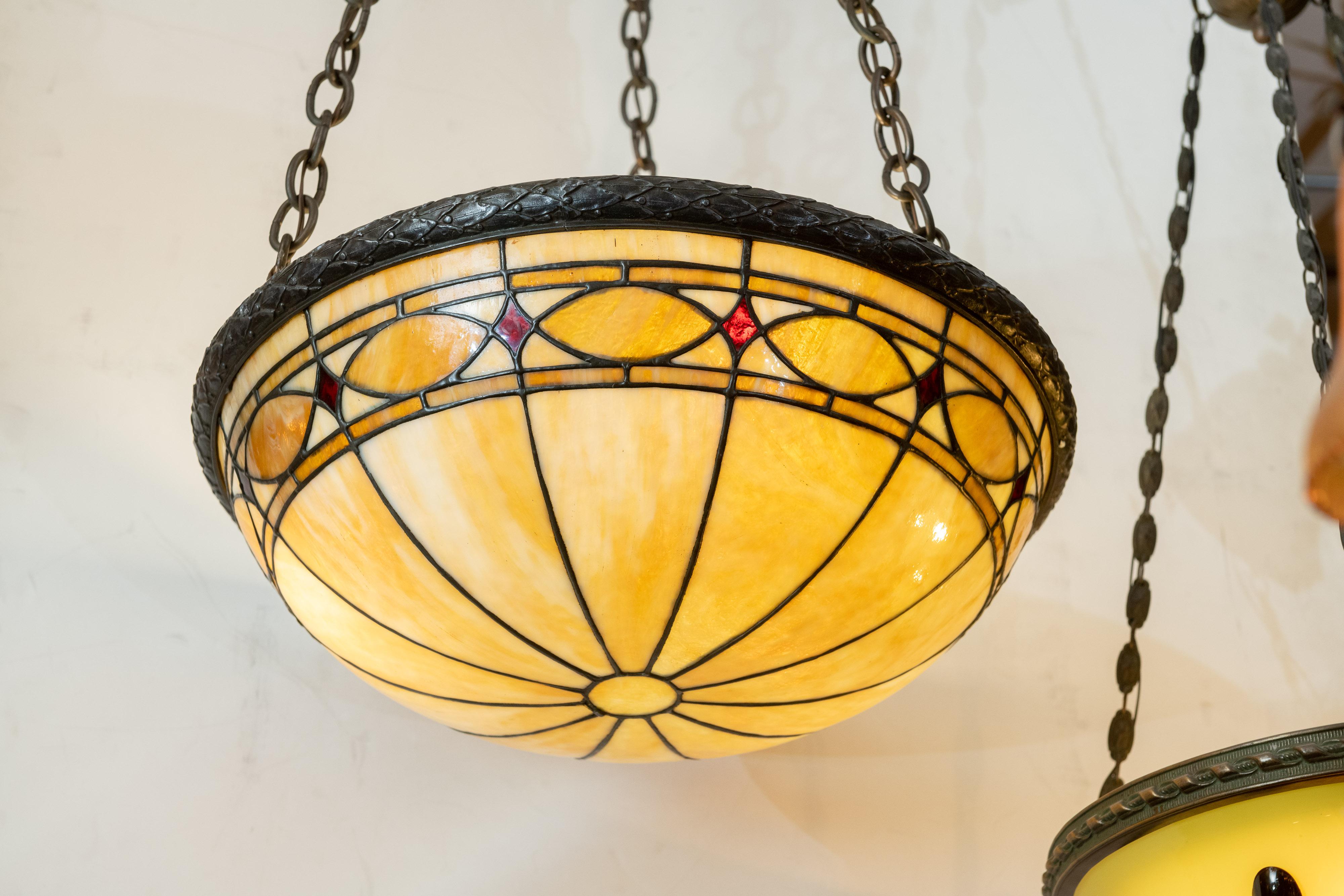 From our experience in selling much leaded glass lamps and chandeliers over 4 decades that these inverted domes are rare and extremely desirable. The typical leaded glass chandelier has an open bottom and so when you look up, the light bulbs can