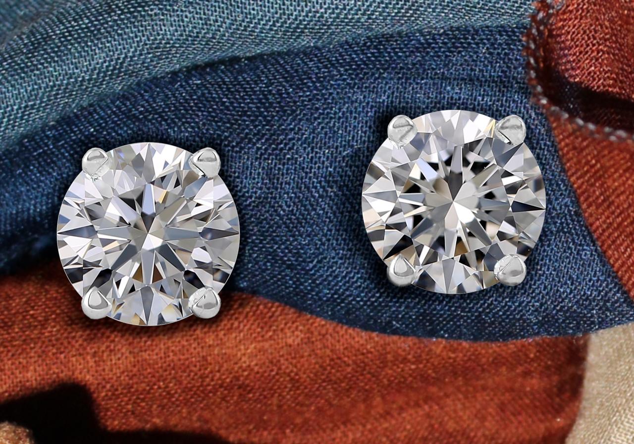 Fantastic round cut diamond studs. The diamonds, totaling 2.04 carats, are certified by GIA, the best diamond certification in the world. 

The color of the two stones is D clarity is Internally Flawless. Due to their characteristics, these stones