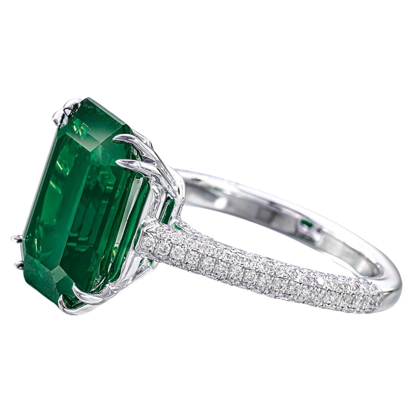 a truly exceptional investment piece: a stunning 3-carat, no-oil emerald ring of the highest quality. This magnificent emerald, prized for its natural beauty and purity, is elegantly set in a luxurious design adorned with 1.50 carats of brilliant