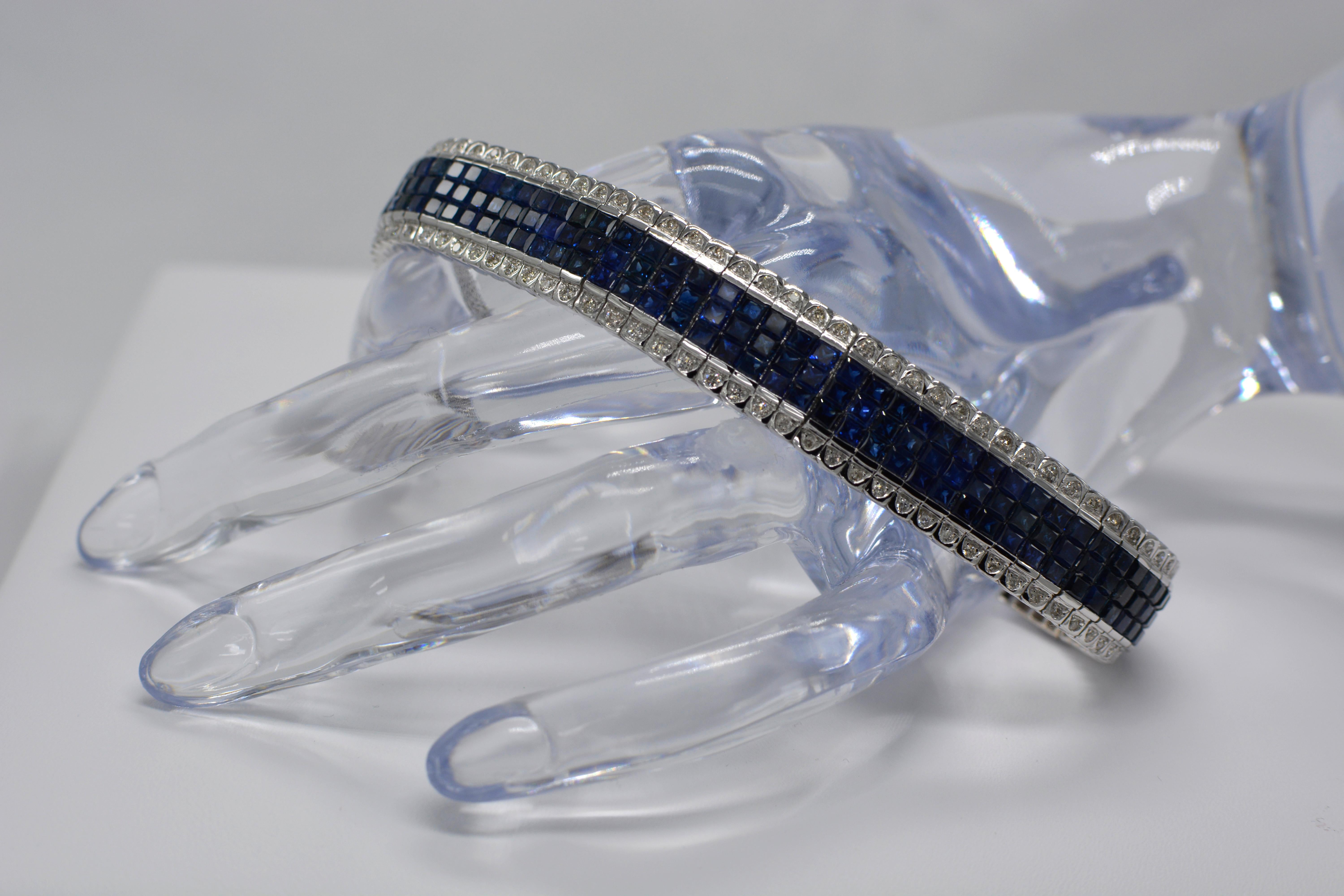 Unique Magnificent Look.
Blue sapphire Invisible Bracelet AAA Quality Sapphires Total of 22.00 carat.
with Diamonds on the sides total of 2.00 carat  GH-SI.
14K White Gold 49.0 Grams.
Length 7' Inch.
Bracelet width is approx. 13 mm
