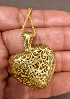 Invisible Mystery Set Sapphire and Diamond Heart Pendant  18 Karat  Yellow Gold