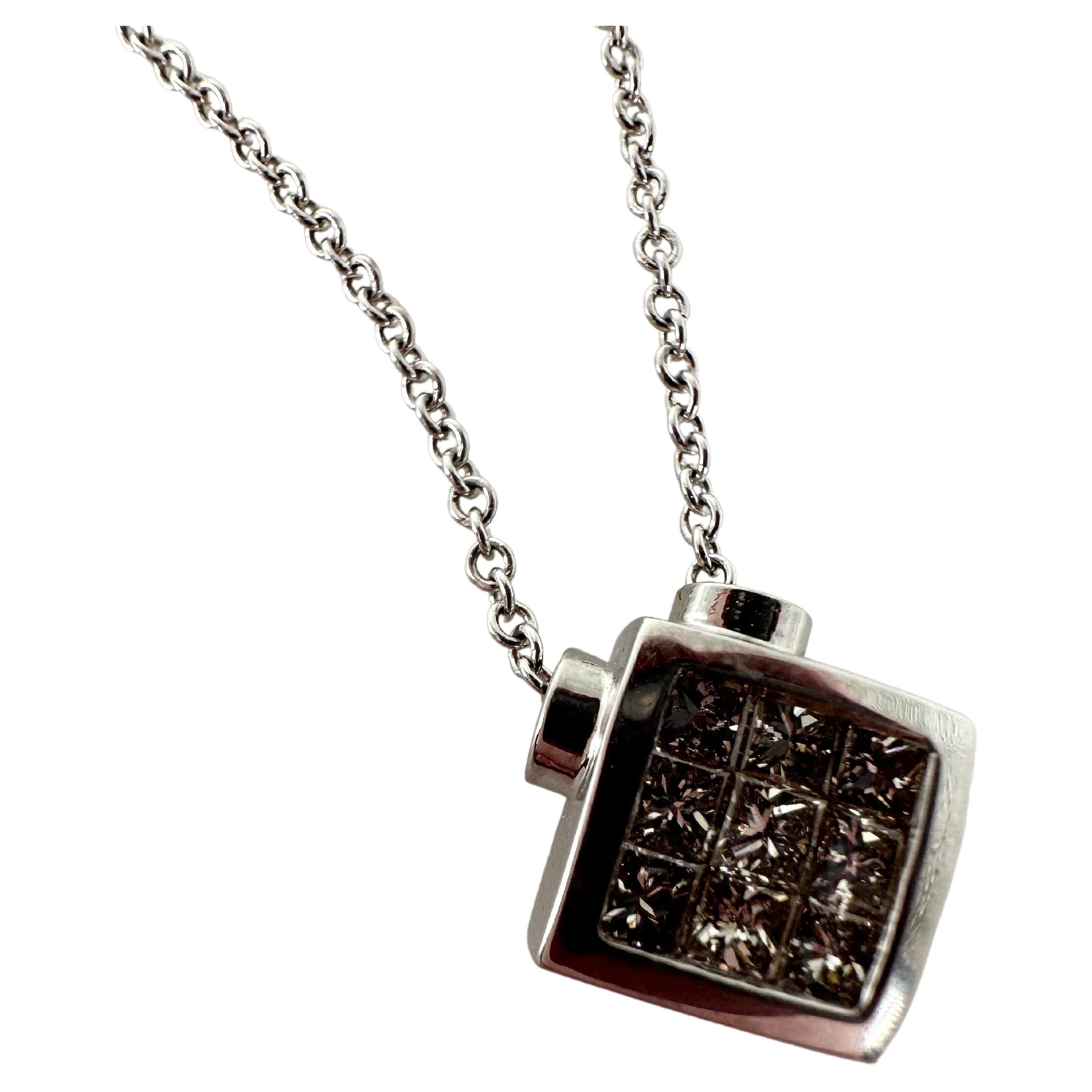 Wonderfully made invisible setting style pendant necklace in 18Kt white gold. The chain is 16