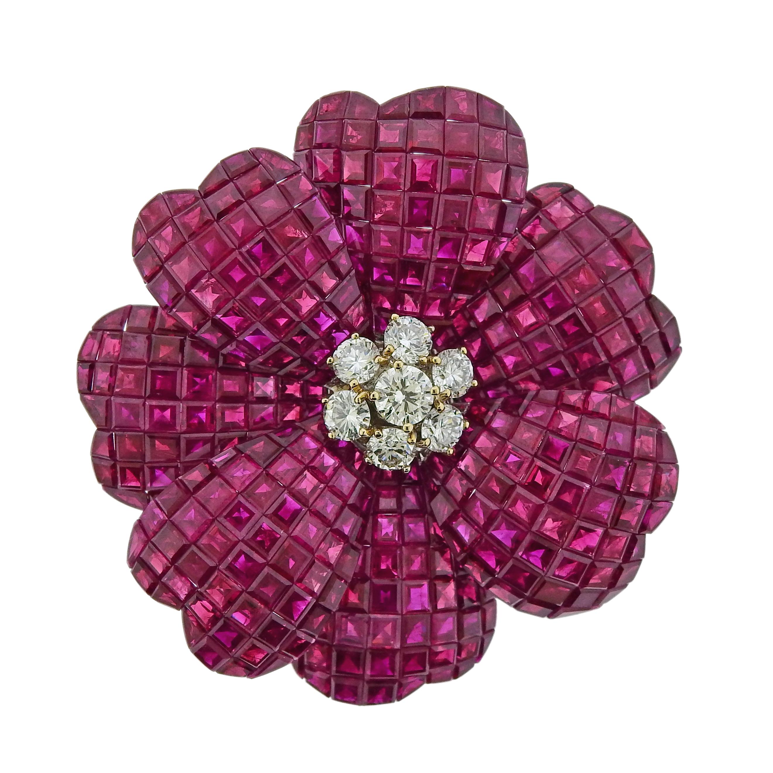Very beautiful intense to vivid color ruby brooch. Total weight of the rubies is 69.98 cts, & total diamond weight is 1.84 cts. Approximate color of diamond is G-H and VS1 clarity, mounted in 18K white gold. 