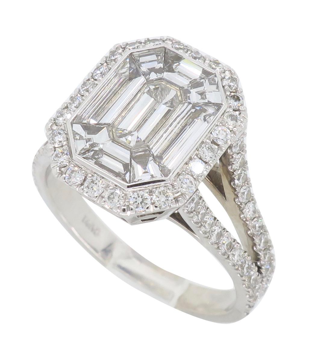 2 carat emerald cut diamond ring on finger