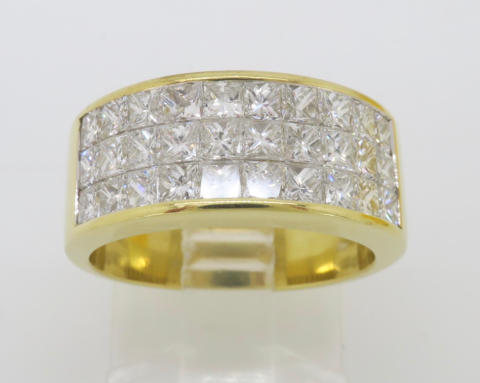 Stunning 3.05ctw invisible set princess cut diamond ring made in 18k yellow gold. 

Diamond Carat Weight: Approximately 3.05CTW
Diamond Cut: Princess Cut Diamonds
Color: Average F-H
Clarity: Average VS-SI
Metal: 18K Yellow Gold
Marked/Tested: