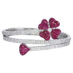 Invisible set floral Ruby bracelet with diamond studded triple coil mechanism
