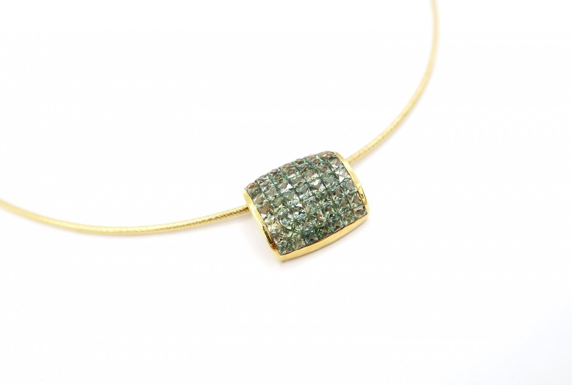 Invisible Set Princess Cut Green Sapphire Aerodynamic 18K Gold Pendant Necklace

Pendant
Gold: 18K Yellow Gold, 4.701 g
Green Sapphire: Princess, 10.40 ct

Necklace
Gold: 18K Yellow Gold, 7.78 g
Length: 16 inches