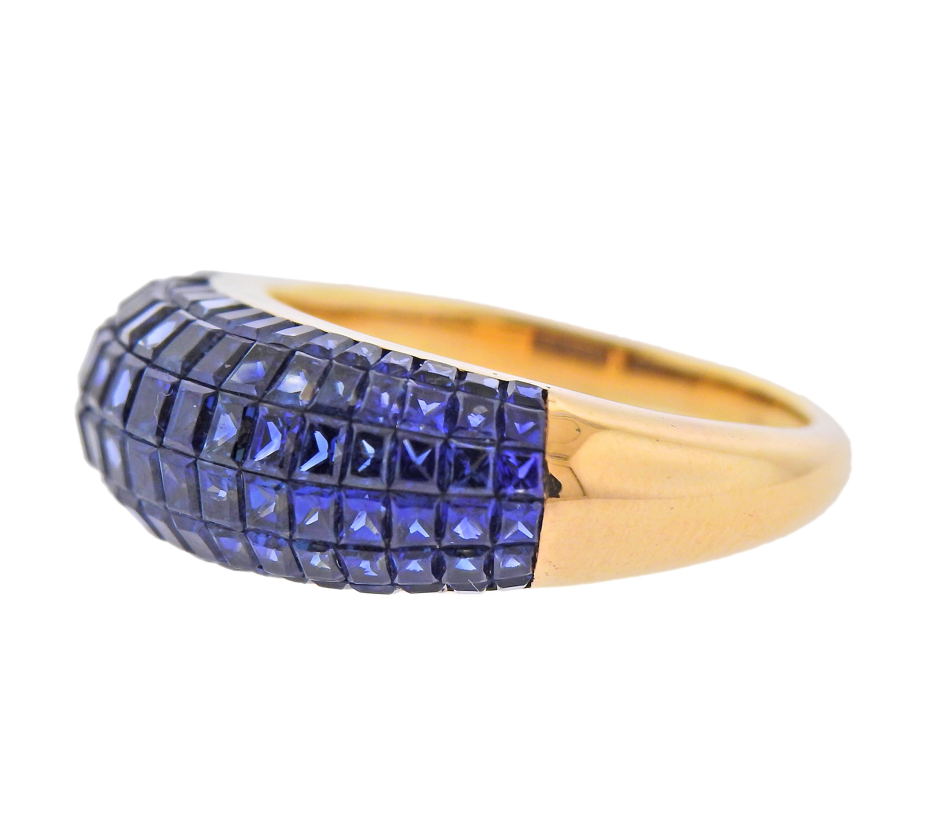 18k gold ring, with invisible set blue sapphires. Ring size - 6.5, ring top is 8mm wide. Weight - 7.7 grams. 