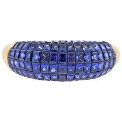 Anello d'oro con zaffiro incastonato invisibile