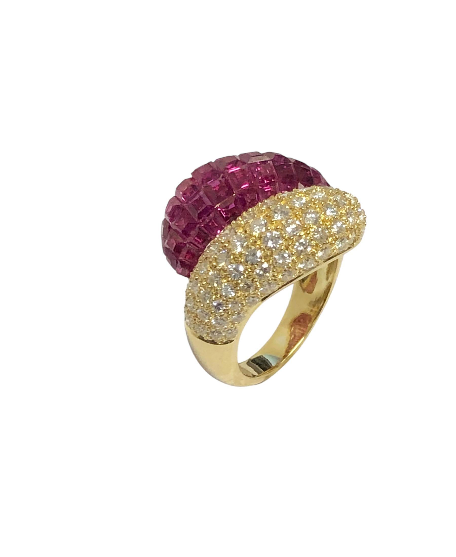 Circa 2000 18k Yellow Gold Bombay Bypass ring, the top measures 7/8 inch wide X 5/8 inch, invisibly set with very fine color stepped cut Rubies totaling 3 carats and round brilliant cut Diamonds totaling 2.25 Carats. A Very fine example of invisible