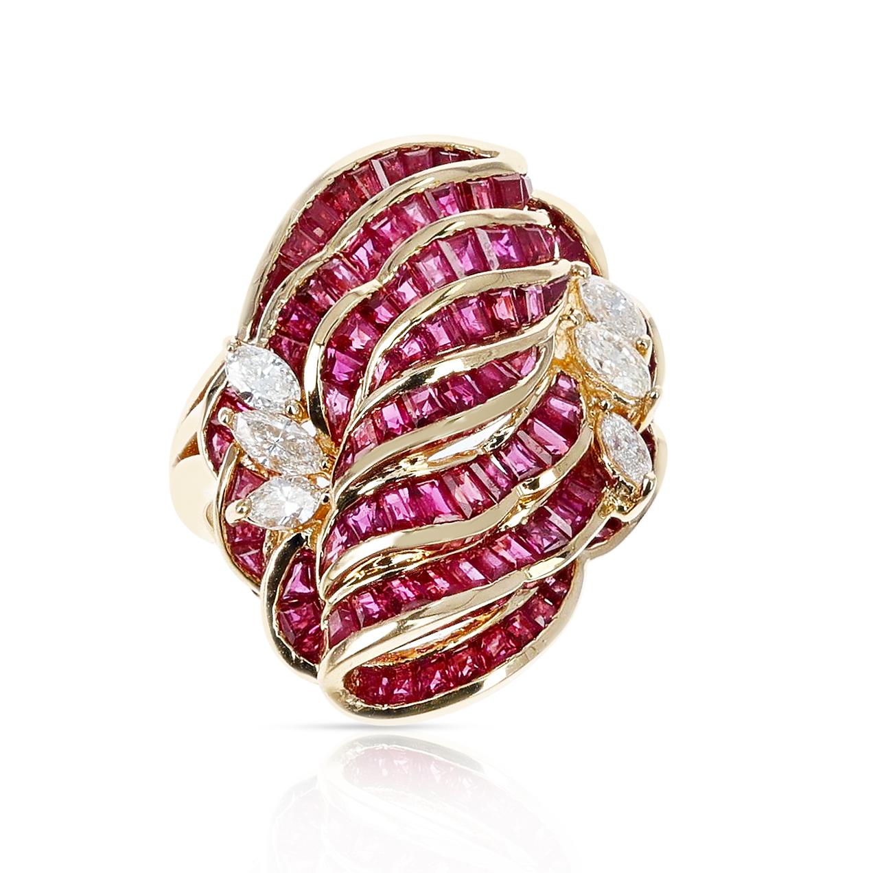 An Invisibly Set 8 Row Ruby Flower-Cut Cocktail Ring with Marquise Diamonds made in 18K Yellow Gold. The total weight of the rubies is 8.70 carats and the total diamond weight is 0.54 carats. The total weight is 13.90 grams. Ring Size US 6.75.  