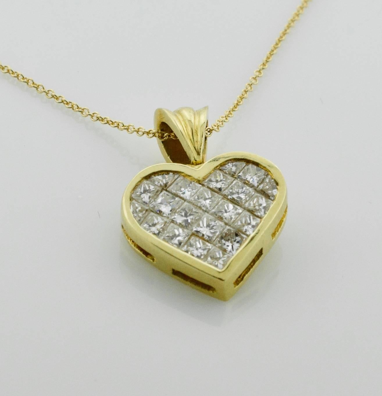 Invisibly Set Diamond Heart in 18k Yellow Gold 2.25 carats. 
Twenty One Princess and Fancy Cut Diamonds weighing 2.25 carats approximately
[fine quality GH VVS-VS]
on a 18k 18