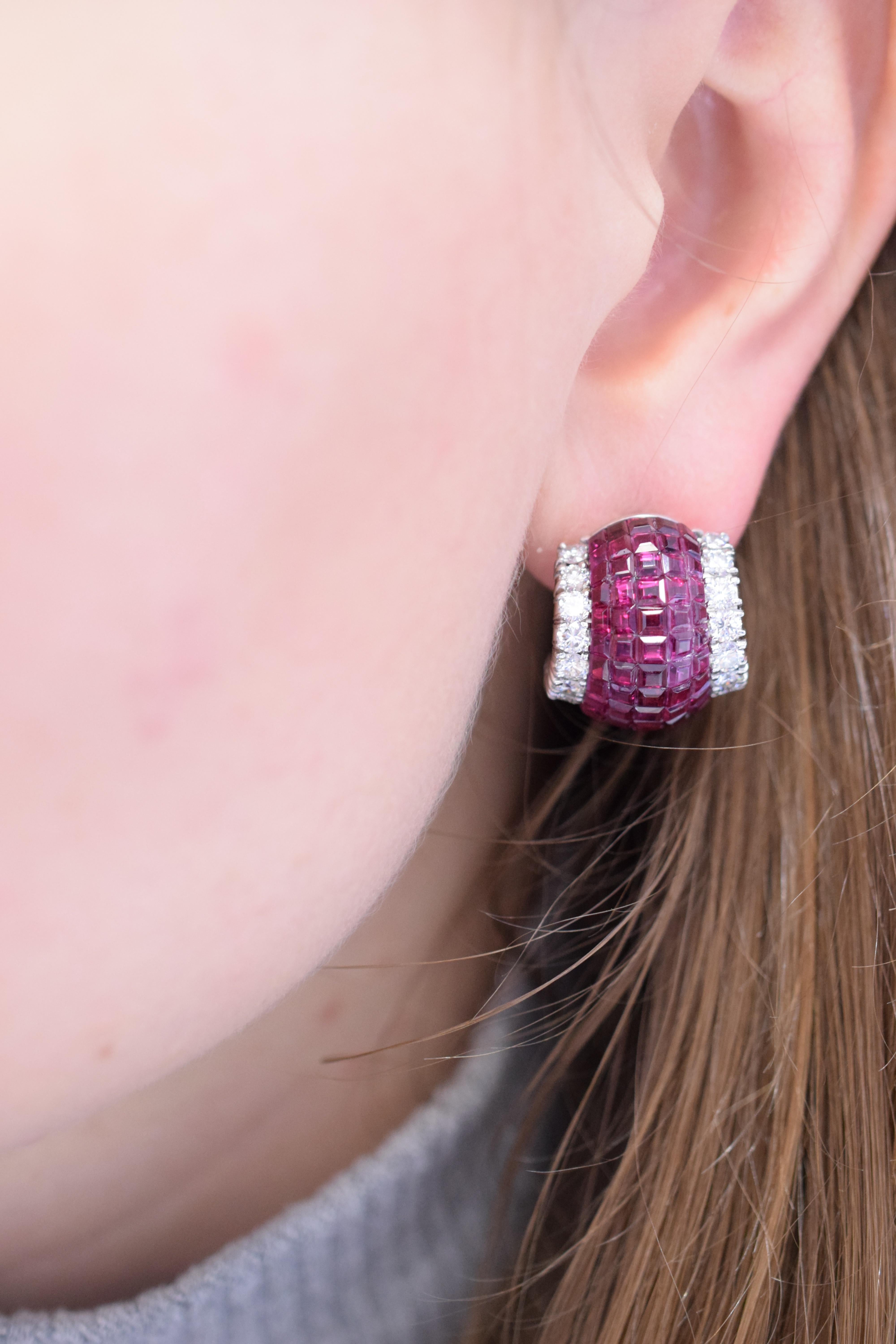 Pair of Platinum, Invisibly-Set Ruby and Diamond Earclips by Aletto Brothers Centering bombé panels of 130 invisibly- set square and fancy- shaped rubies approximately 12.00 carats, flanked by 36 round diamonds approximately 3.00 carats ( Colorless